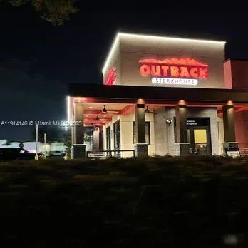 a view of swimming pool from a balcony