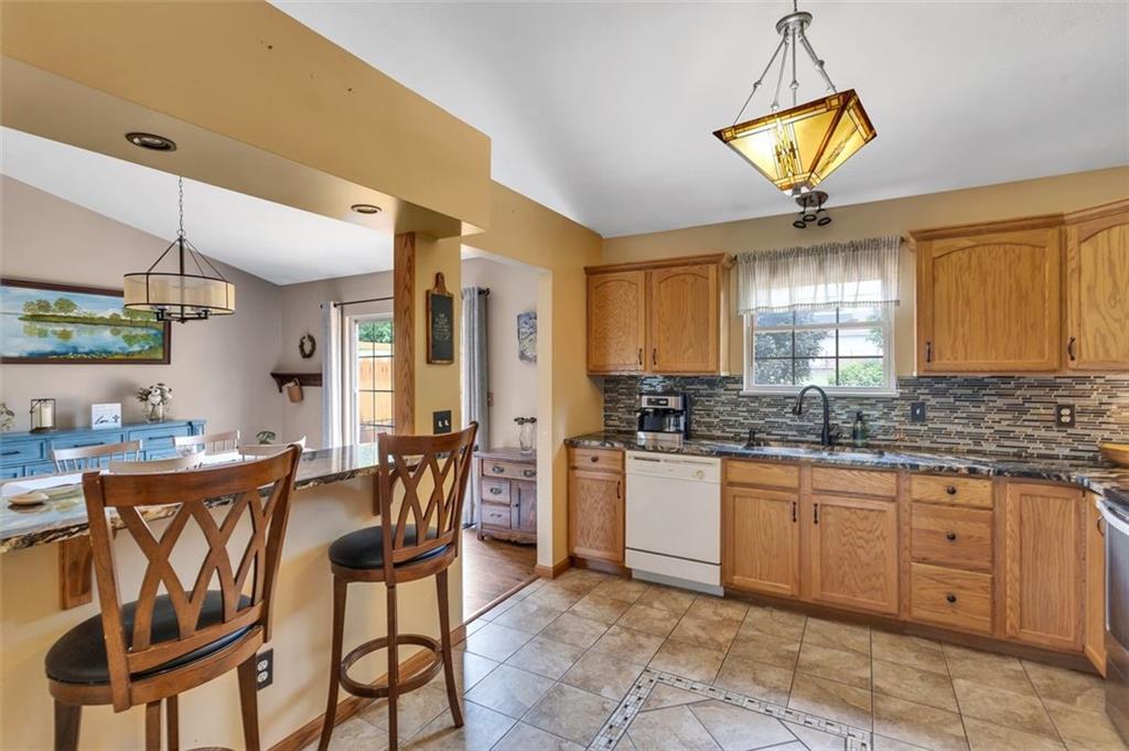 152 Cupps Road Renfrew, PA 16053 - Photo 23 of 43 a kitchen with stainless steel appliances granite countertop a sink a stove and a refrigerator