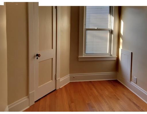 90 Lucerne Road Springfield, MA 01119 - Photo 13 of 24 a view of an empty room with wooden floor and a window