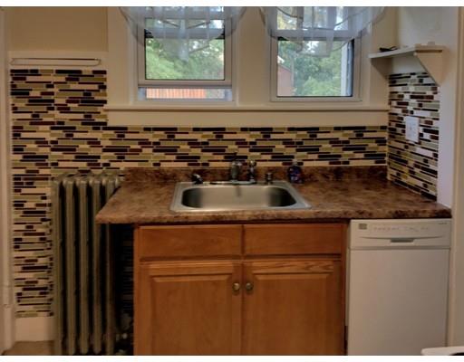 90 Lucerne Road Springfield, MA 01119 - Photo 6 of 24 a kitchen with a sink a stove cabinets and a window