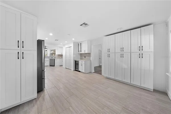 a large kitchen with cabinets