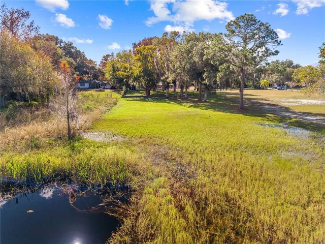 a view of an swimming pool with an outdoor space and seating area