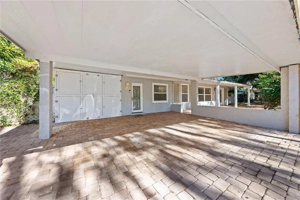 a view of a bedroom with wooden floor and a bed