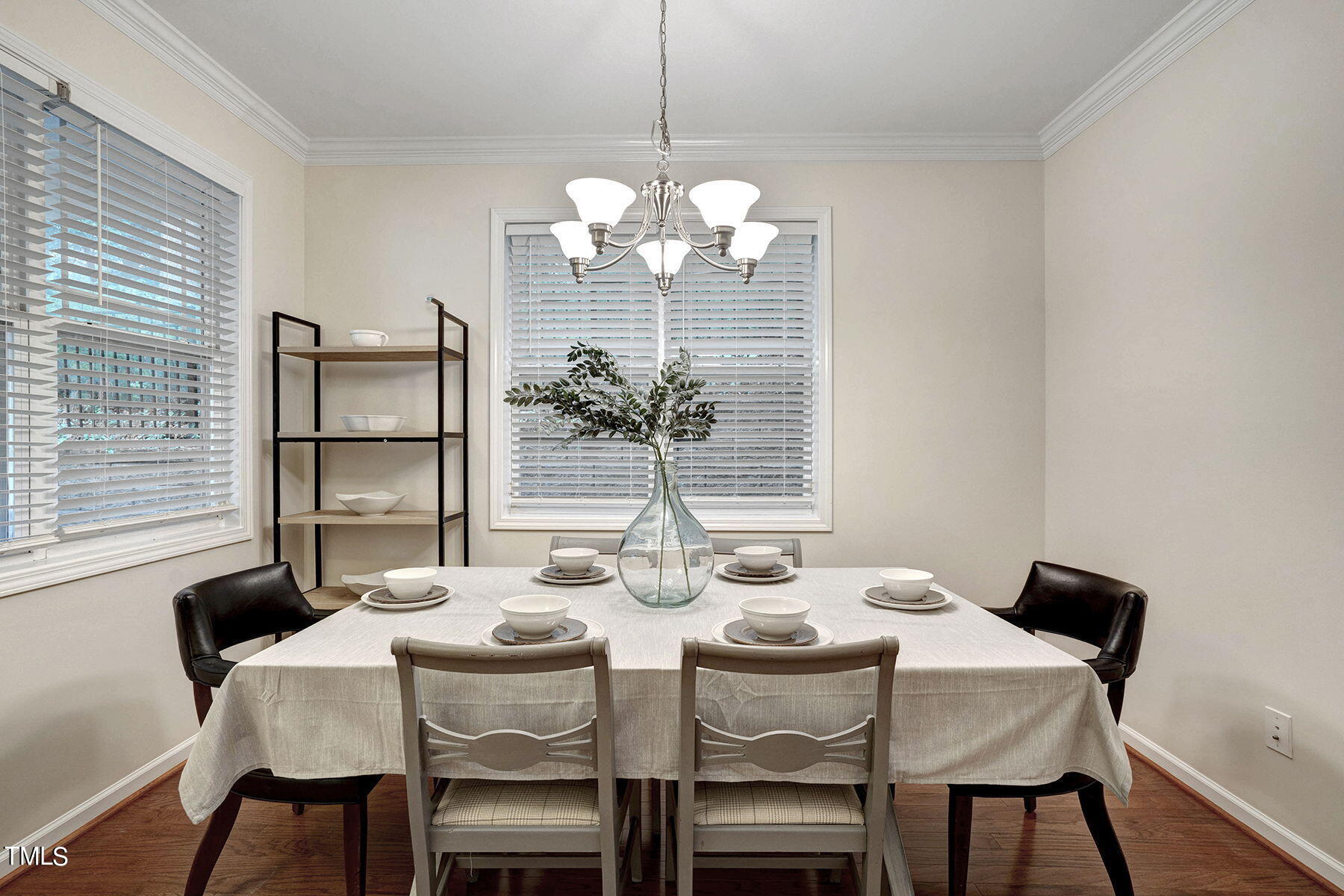 4603 Altha Street Raleigh, NC 27606 - Photo 5 of 27 a view of a dining room with furniture a chandelier and wooden floor
