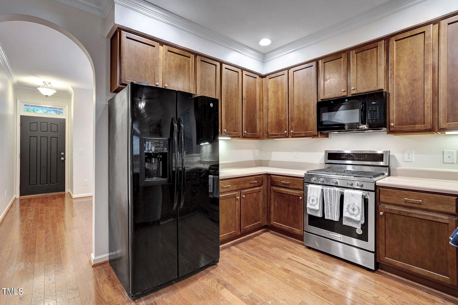 4603 Altha Street Raleigh, NC 27606 - Photo 8 of 27 a kitchen with a refrigerator stove and microwave