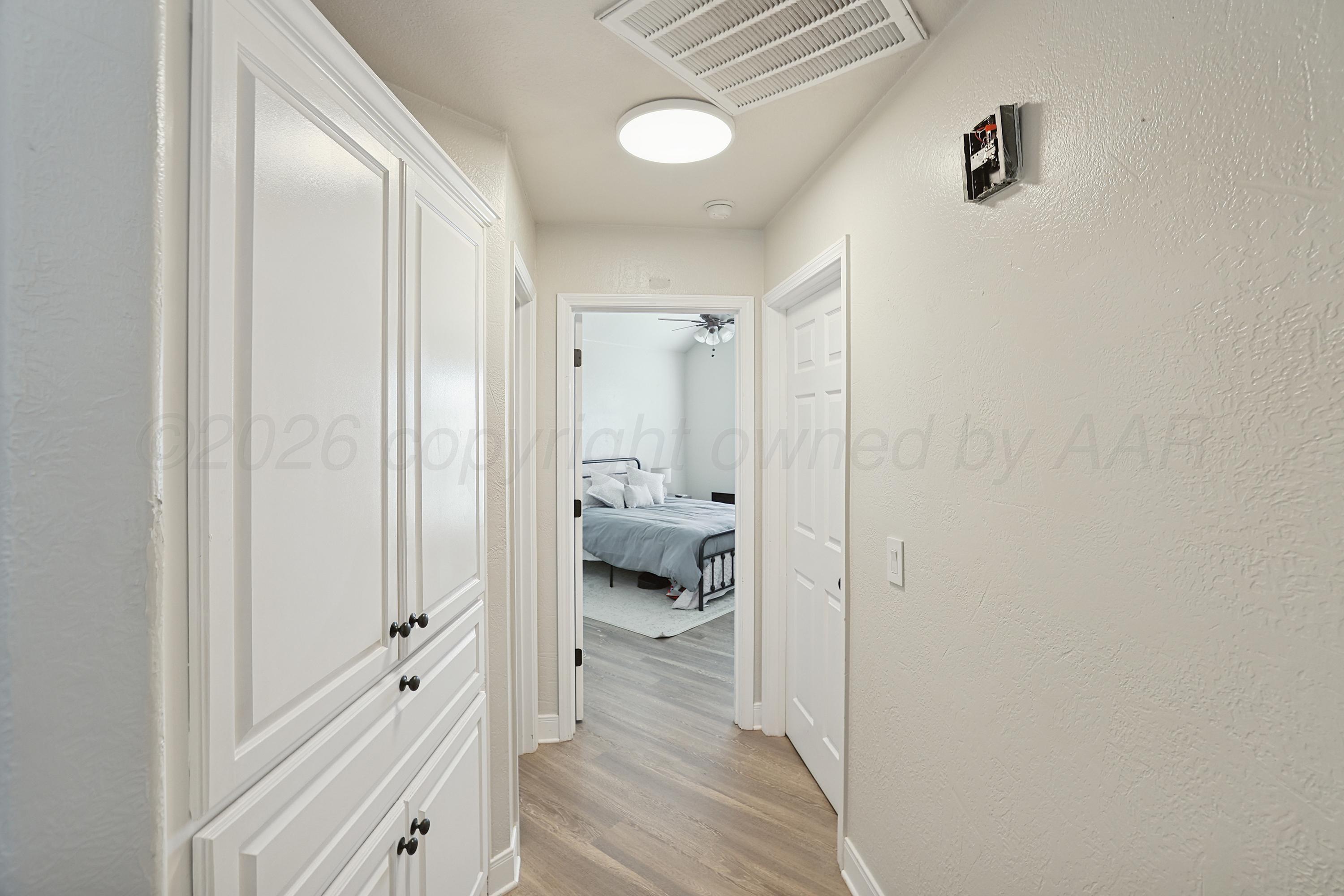 6400 Rally Road Amarillo, TX 79119 - Photo 12 of 21 a bathroom with a glass shower door