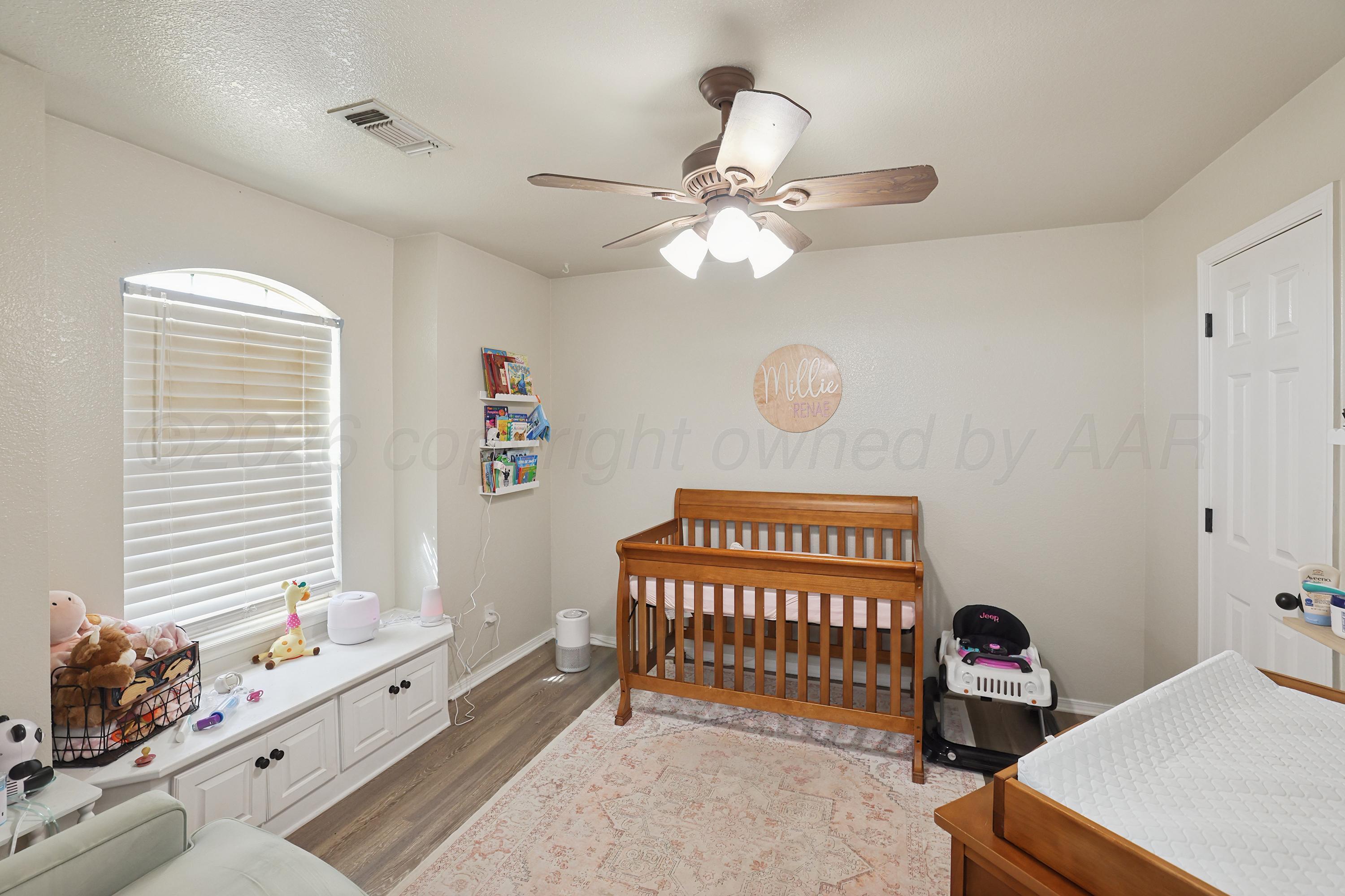 6400 Rally Road Amarillo, TX 79119 - Photo 15 of 21 a bedroom with furniture and a window