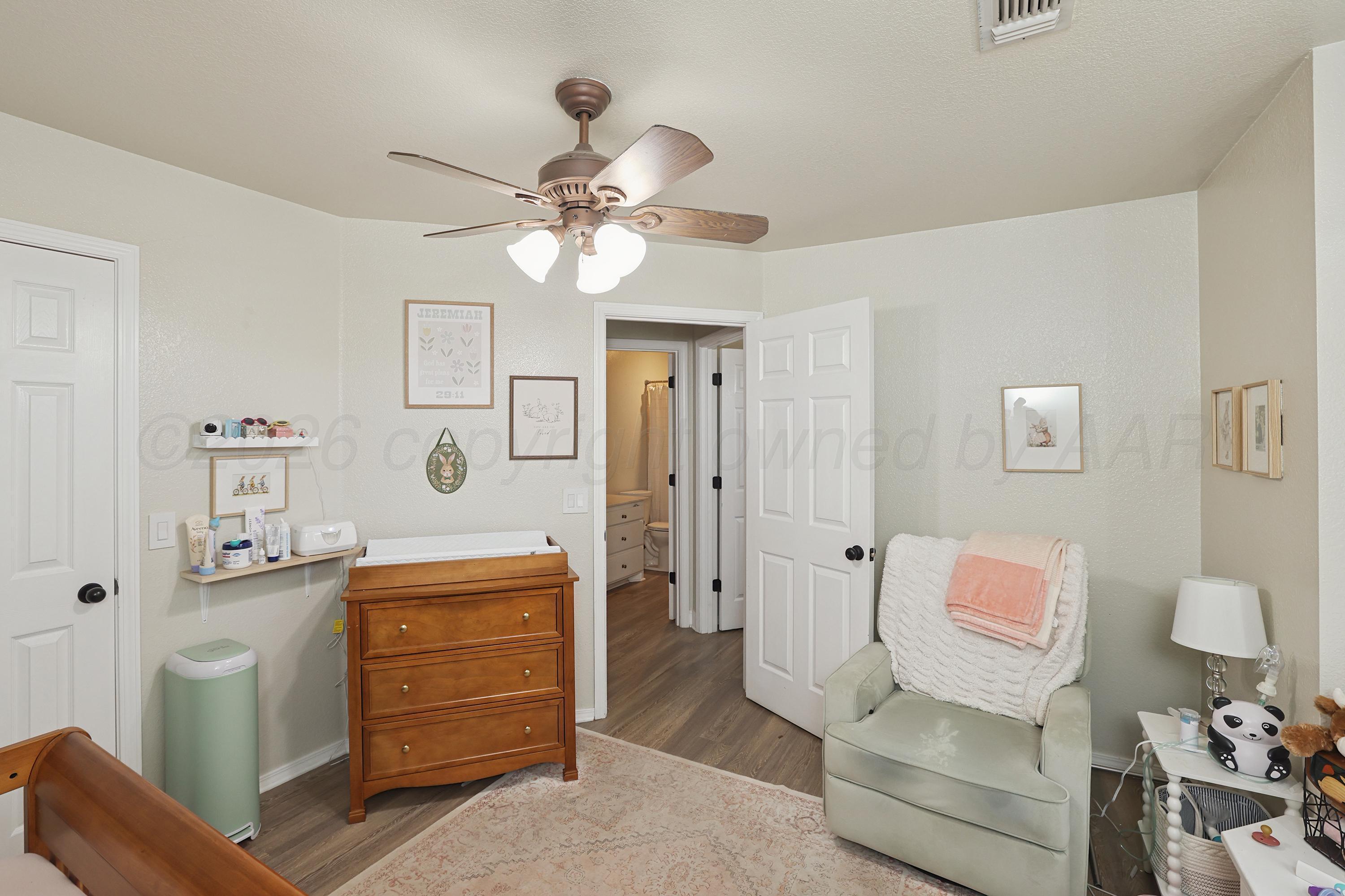 6400 Rally Road Amarillo, TX 79119 - Photo 16 of 21 a living room with furniture and a ceiling fan