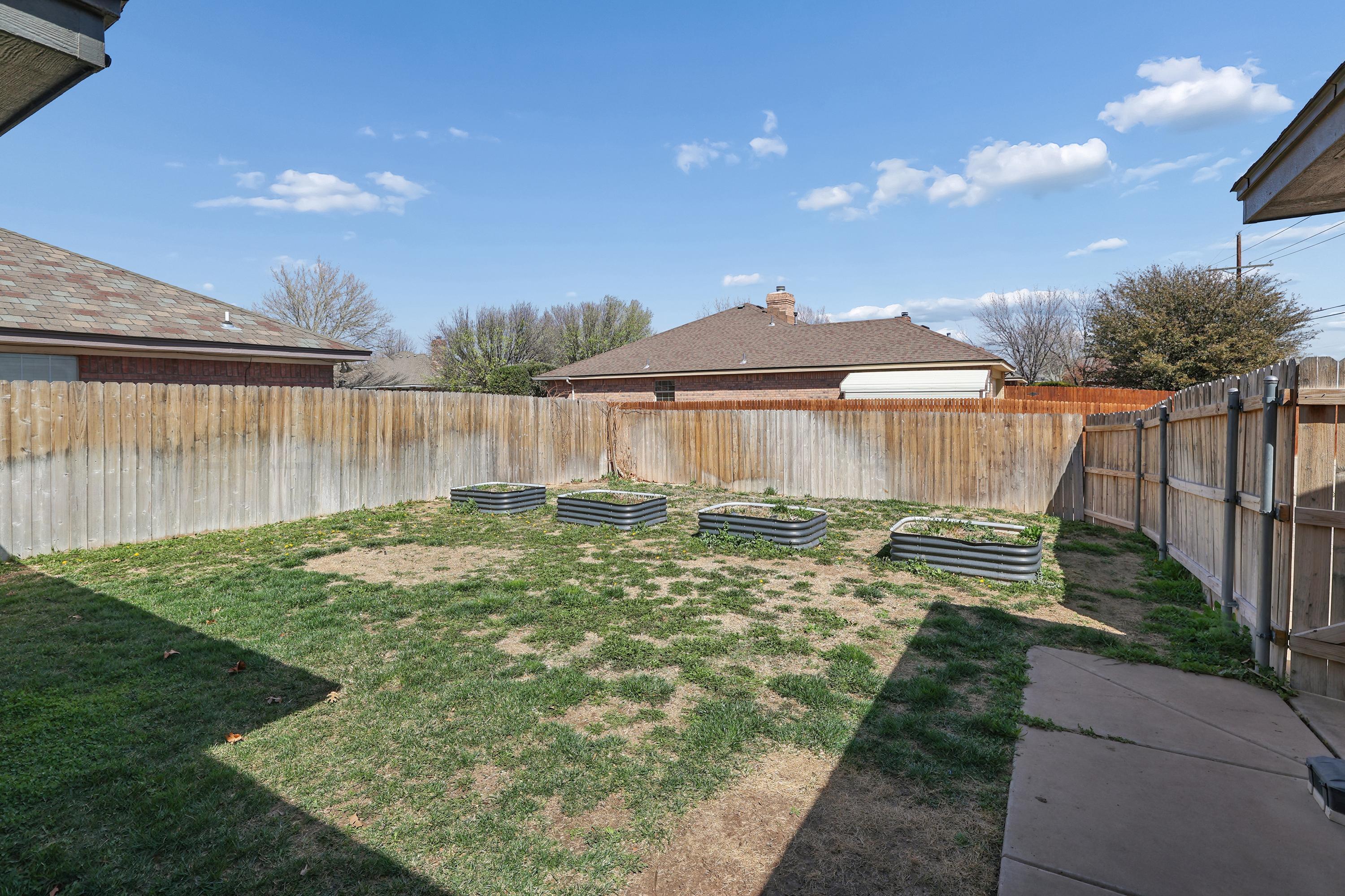 6400 Rally Road Amarillo, TX 79119 - Photo 20 of 21 a view of a house with backyard and sitting area