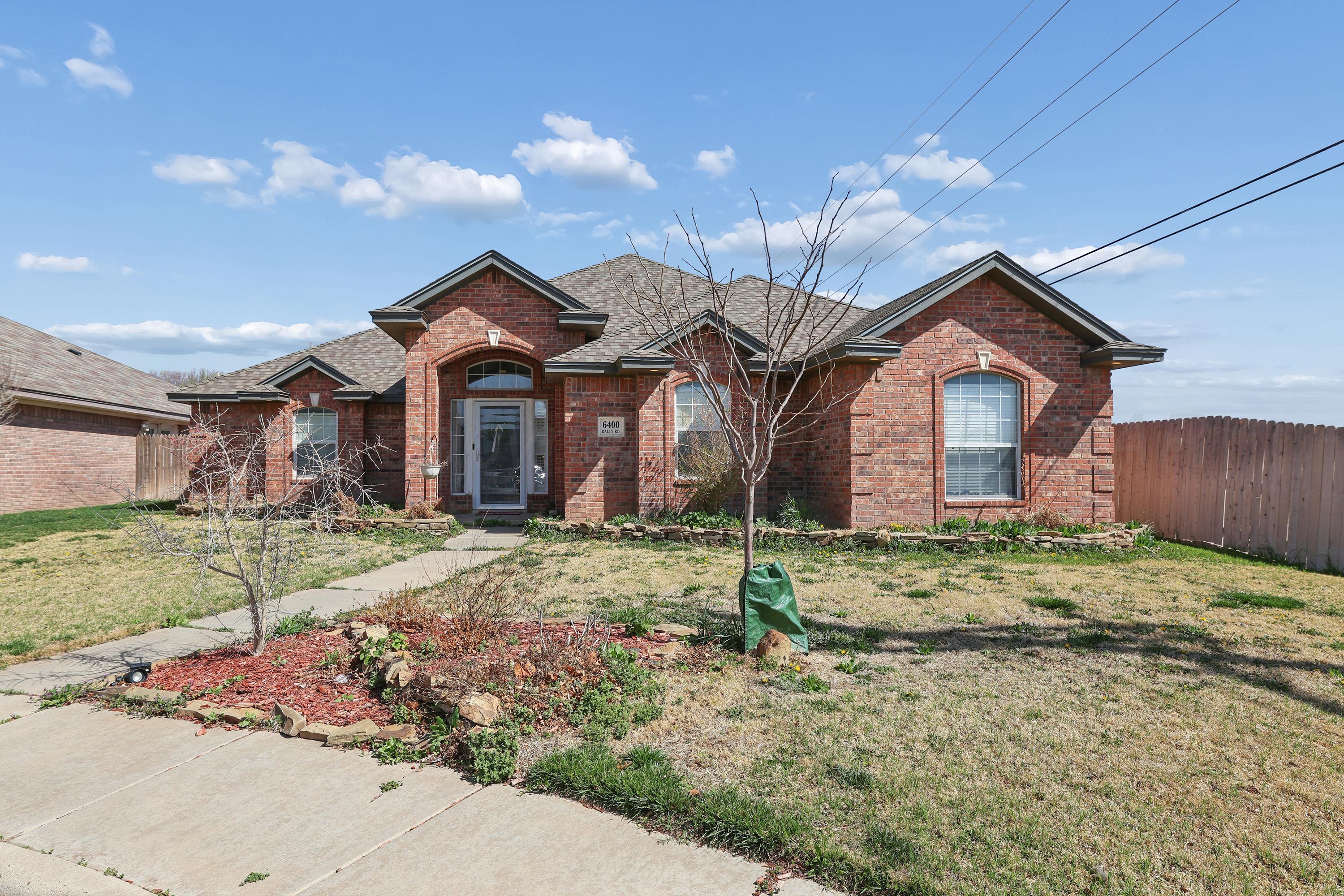 6400 Rally Road Amarillo, TX 79119 - Photo 2 of 21 a front view of a house with a yard