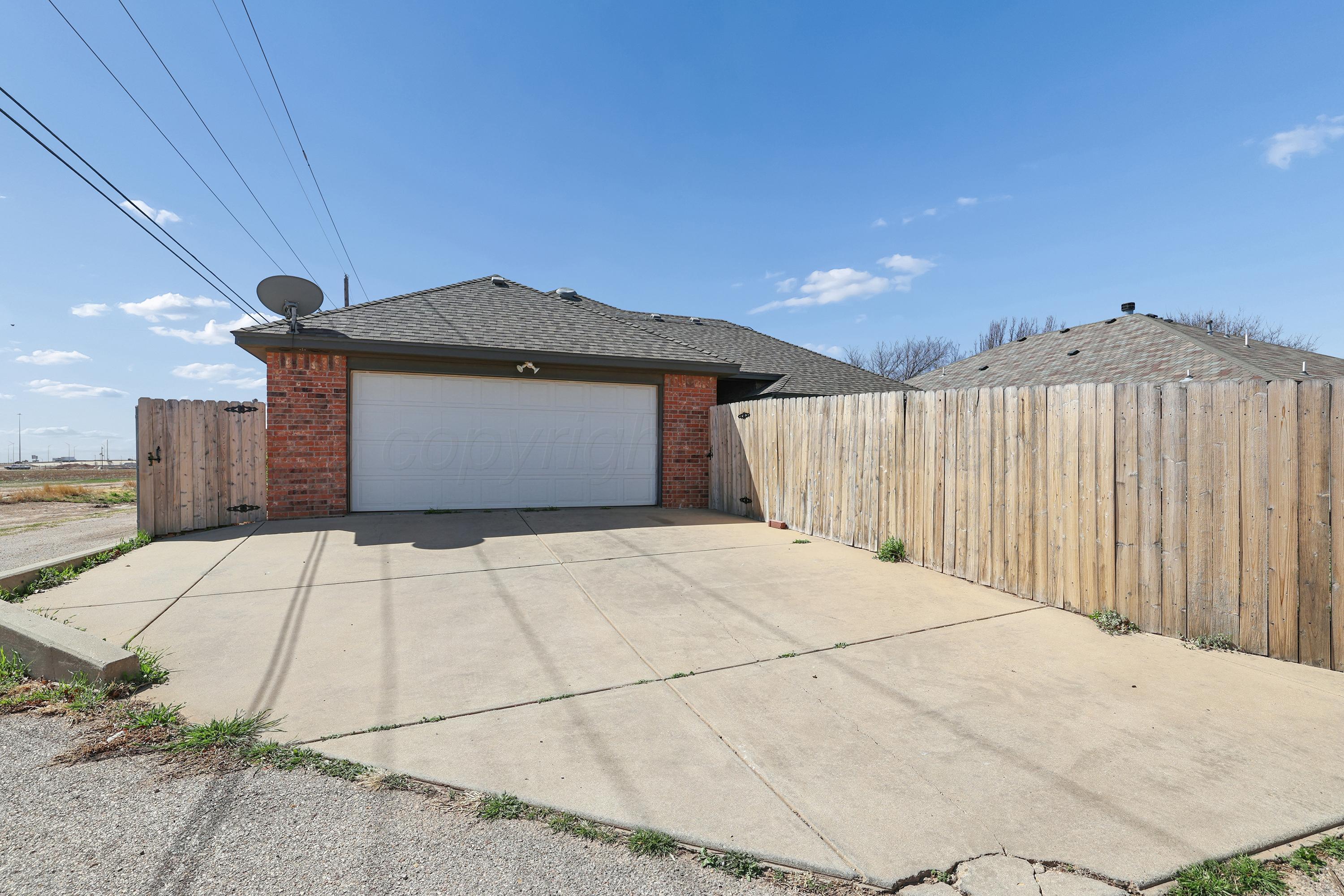 6400 Rally Road Amarillo, TX 79119 - Photo 21 of 21 a front view of a house with a yard