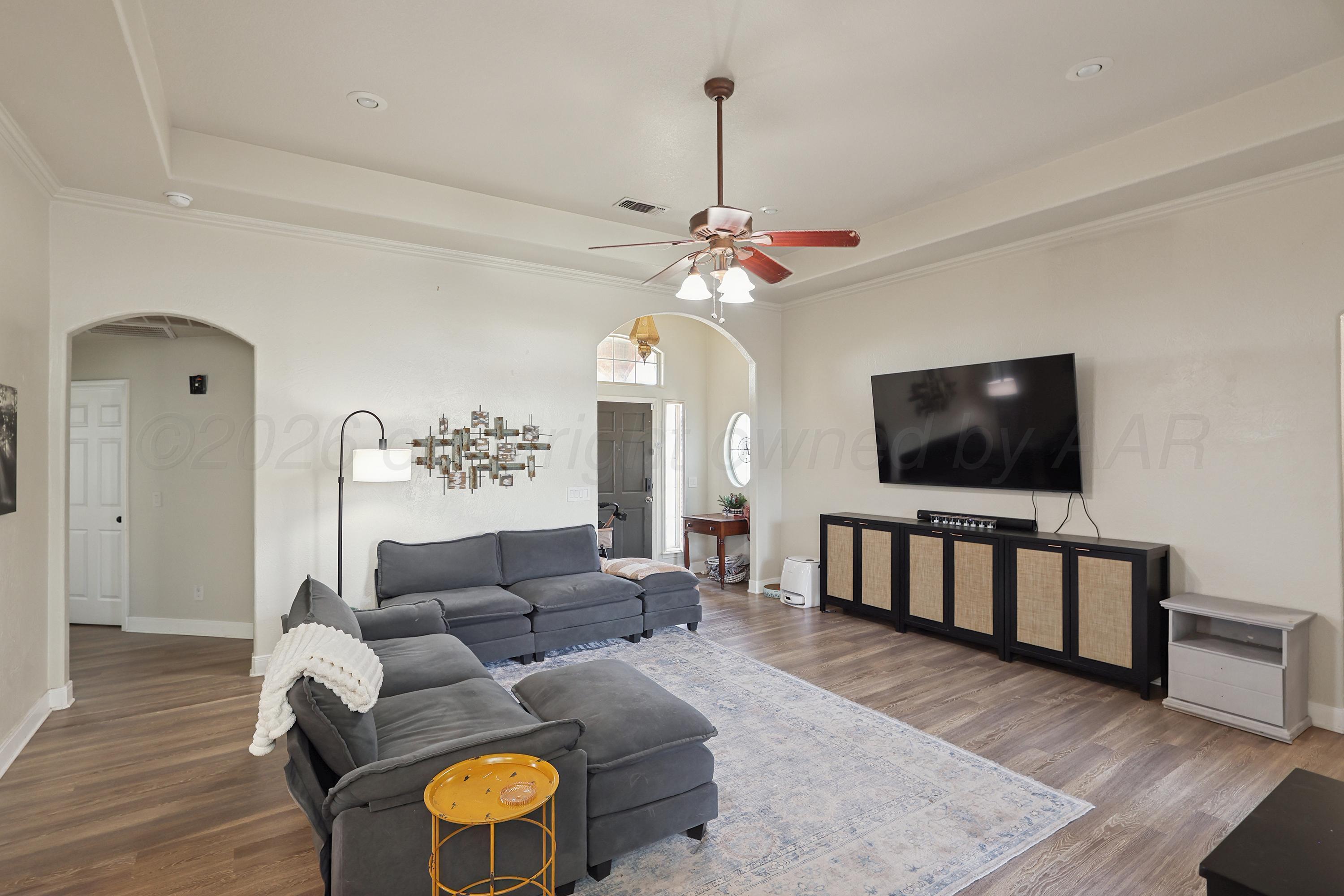 6400 Rally Road Amarillo, TX 79119 - Photo 4 of 21 a living room with furniture and a flat screen tv