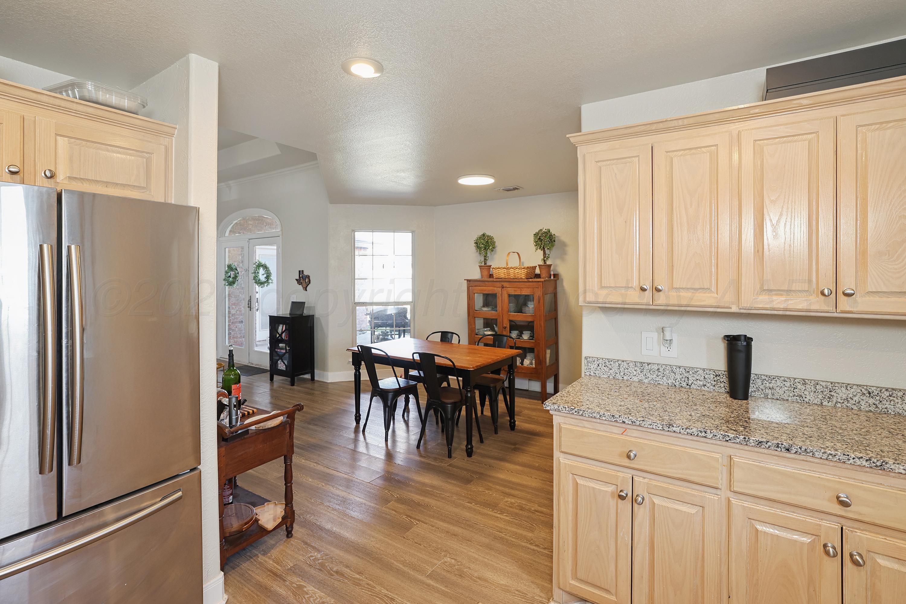 6400 Rally Road Amarillo, TX 79119 - Photo 7 of 21 a kitchen with stainless steel appliances granite countertop a refrigerator and a sink