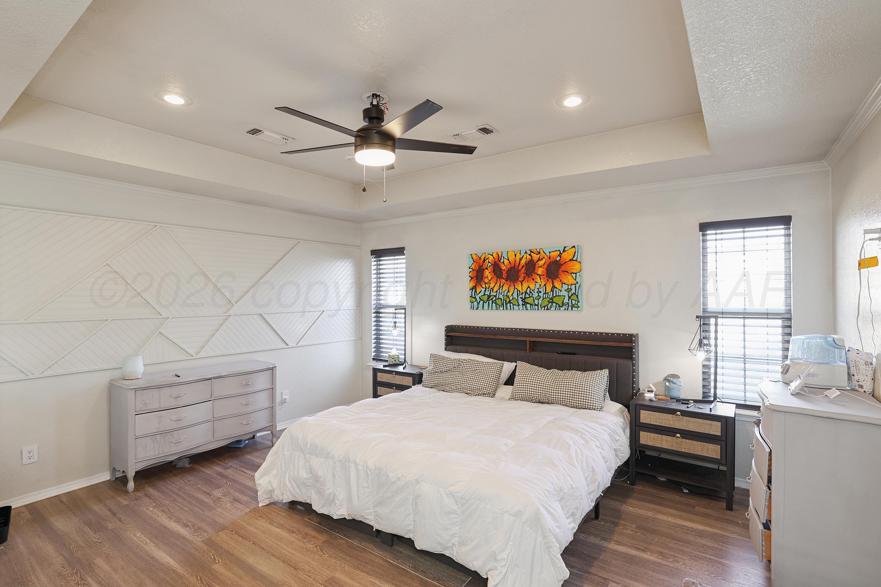 6400 Rally Road Amarillo, TX 79119 - Photo 8 of 21 a bedroom with a bed and a large window