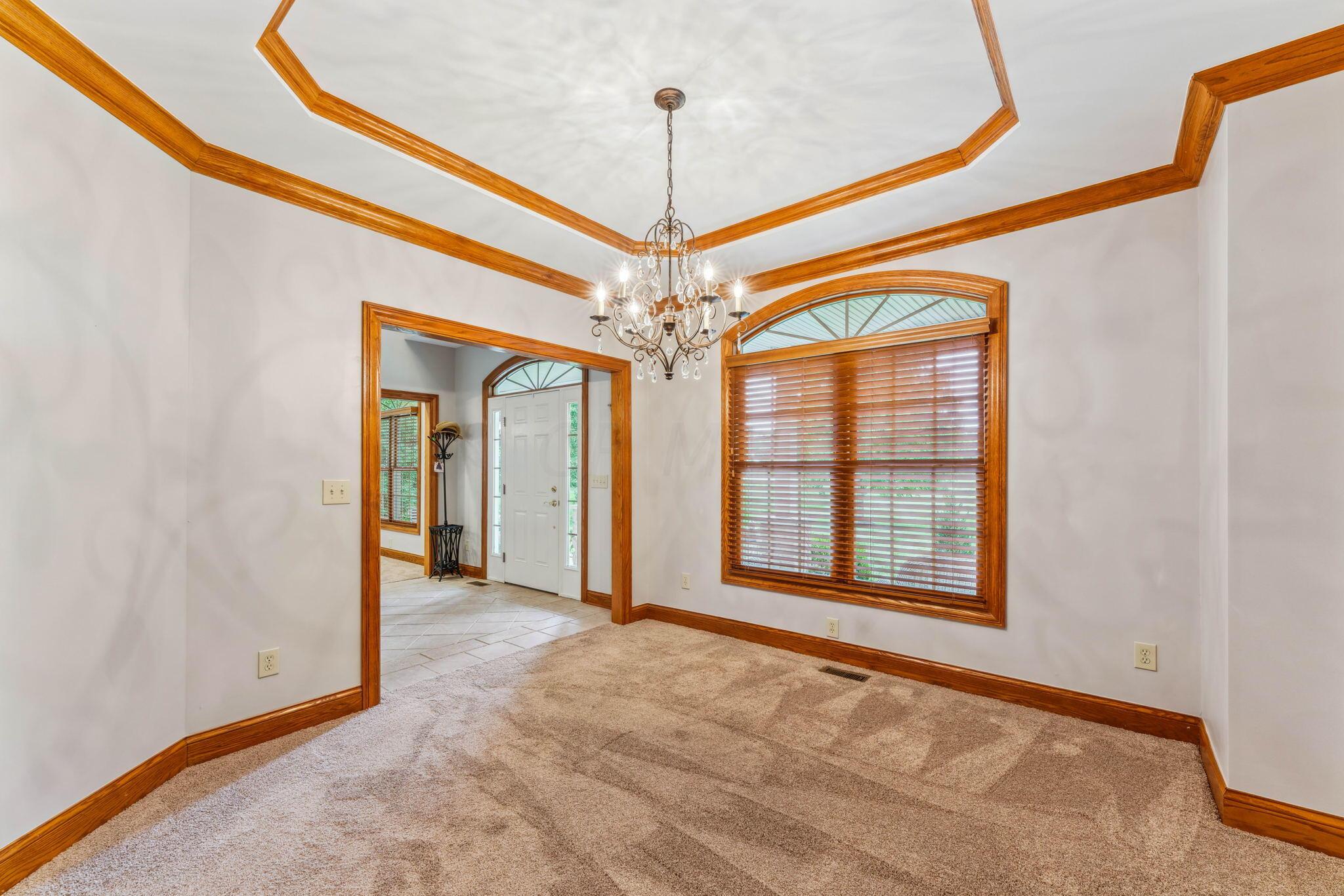 8242 Dustin Road Galena, OH 43021 - Photo 12 of 111 Coffered ceiling. crystal chandelier and new carpet