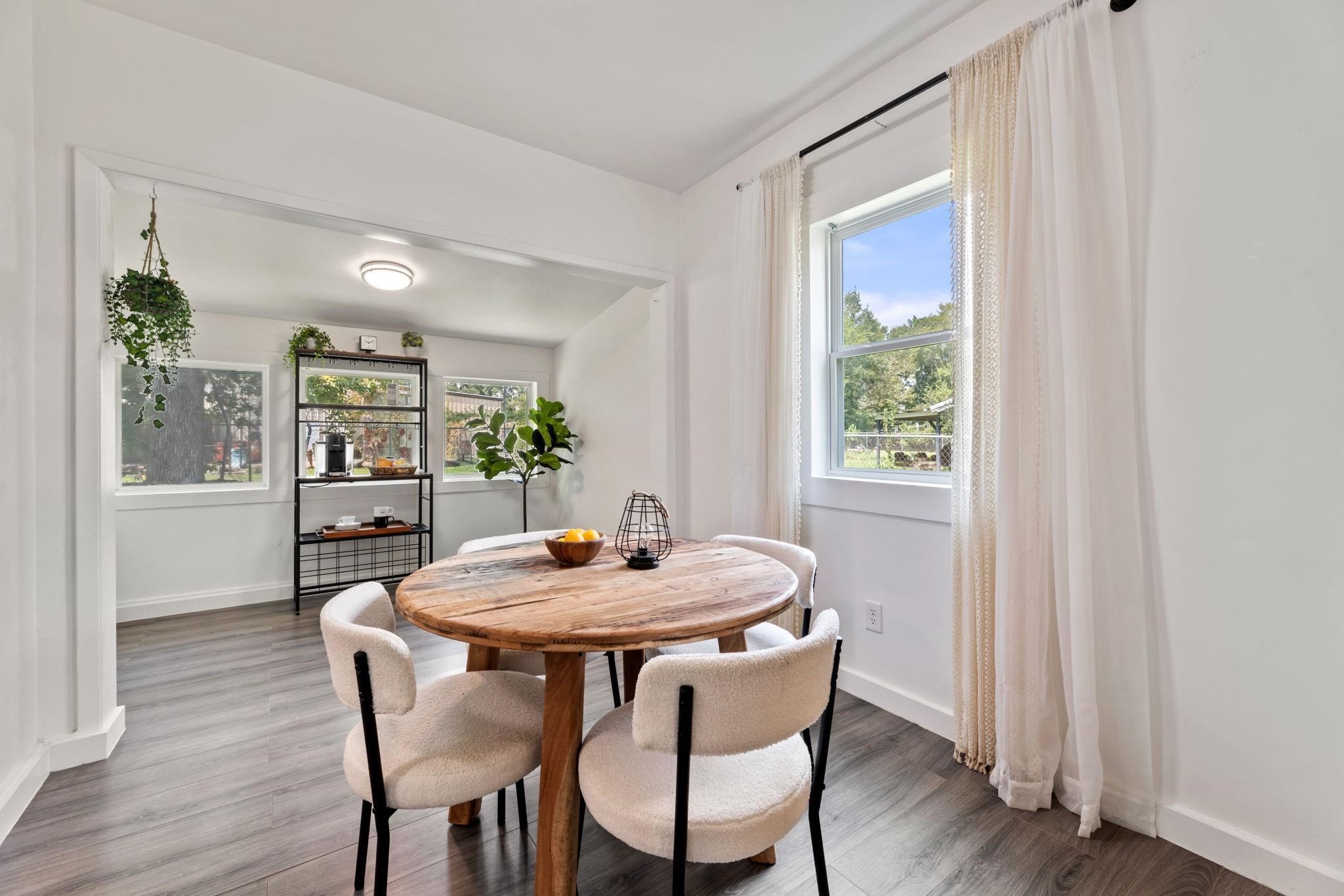 1010 Long Street Conroe, TX 77301 - Photo 13 of 26 a dining room with furniture and window