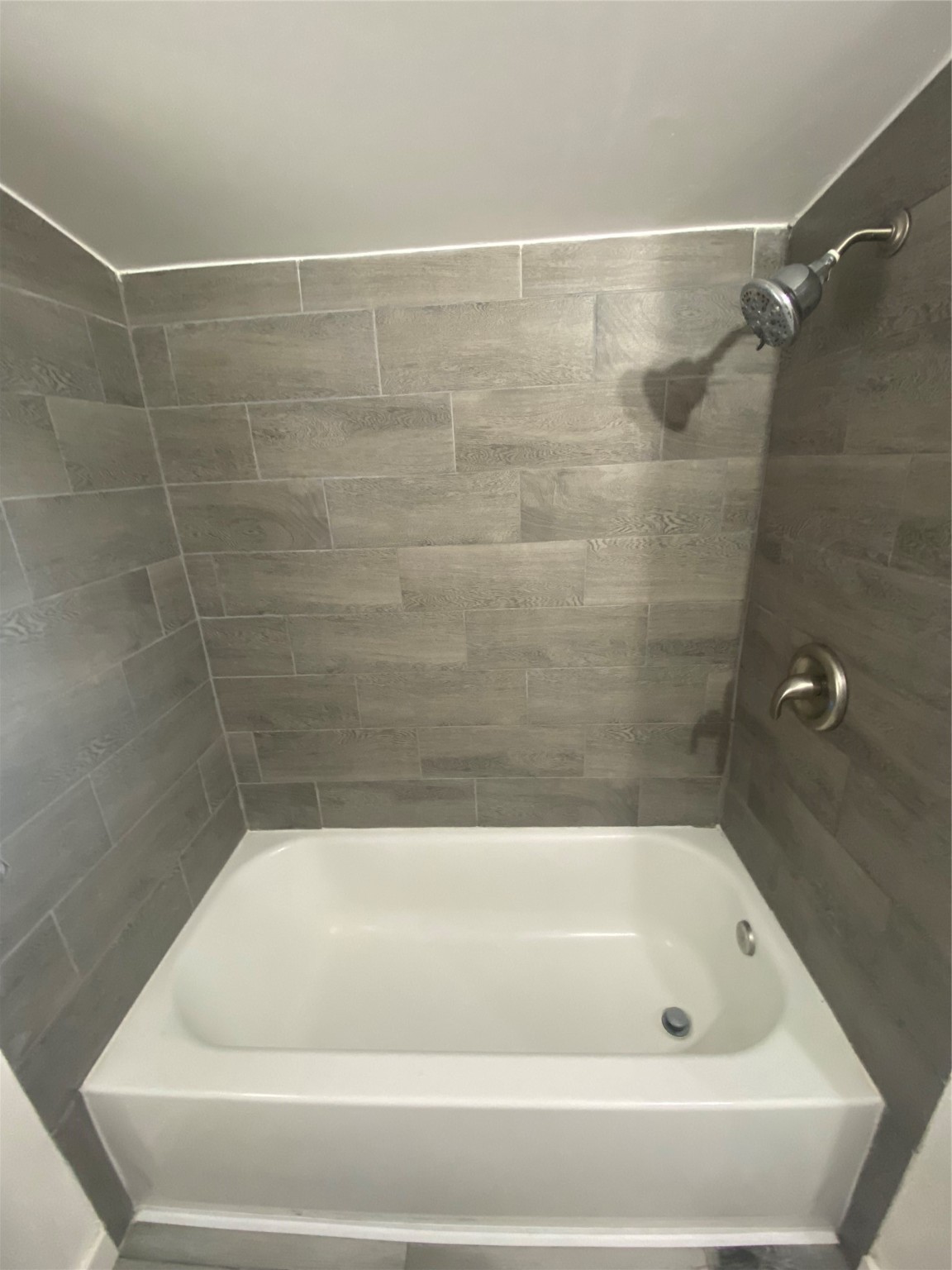 1010 Long Street Conroe, TX 77301 - Photo 16 of 26 a bathroom with a bath tub