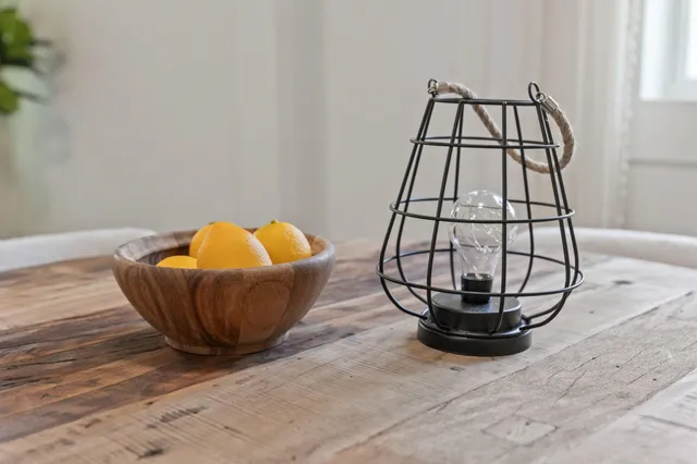 a bedroom with bed and a large mirror