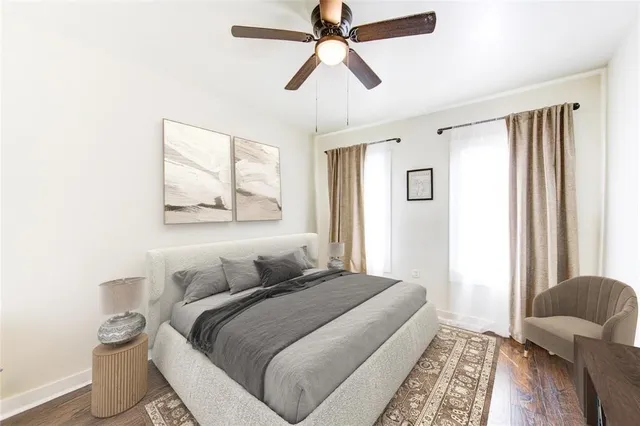 a bedroom with bed and a window