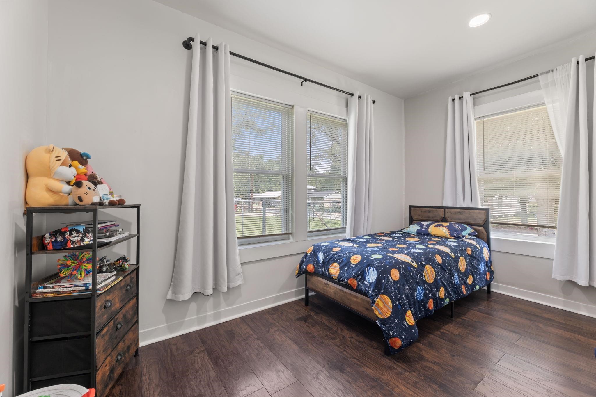 1010 Long Street Conroe, TX 77301 - Photo 22 of 26 a bedroom with bed and a window