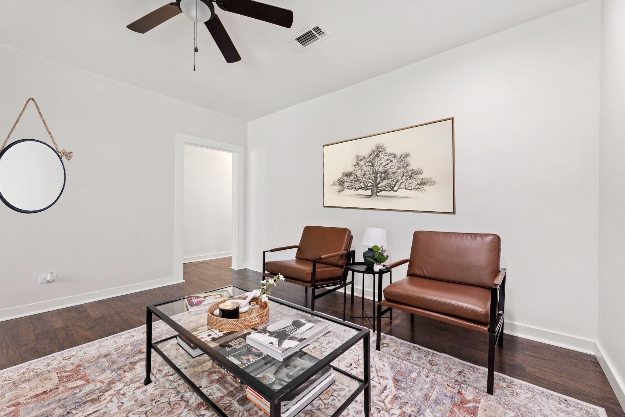 1010 Long Street Conroe, TX 77301 - Photo 4 of 26 a living room with furniture and a rug
