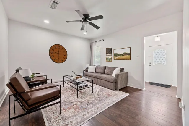 a living room with furniture and a rug
