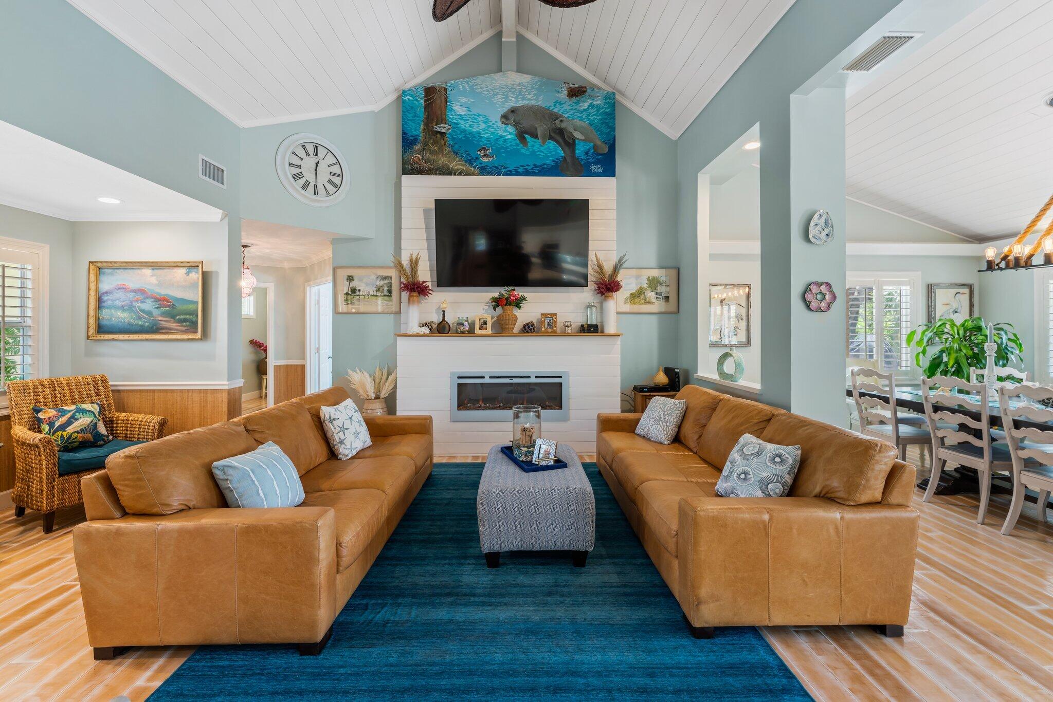 4120 Southeast Whiticar Way Stuart, FL 34997 - Photo 11 of 60 a living room with fireplace furniture and a flat screen tv