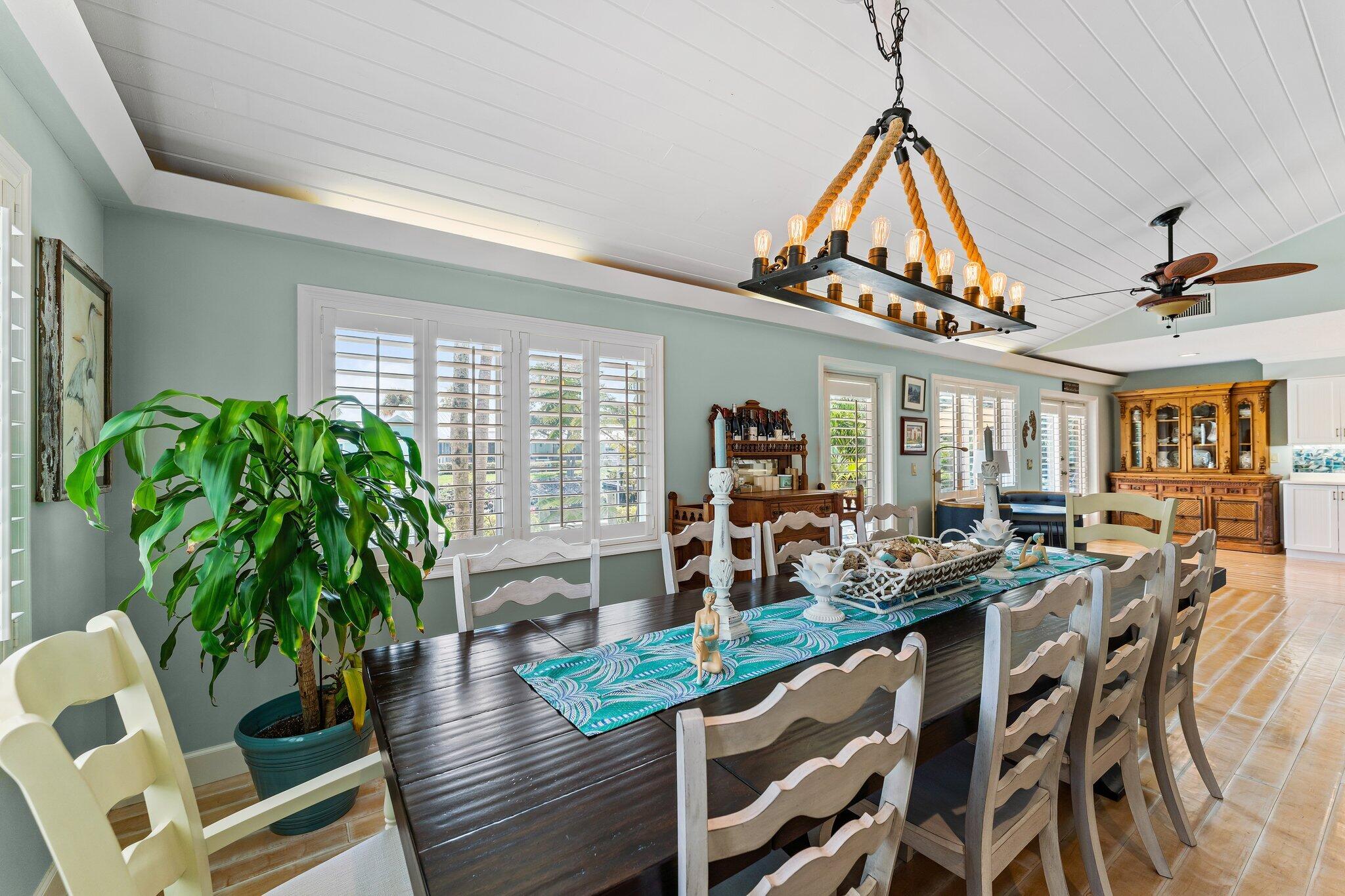 4120 Southeast Whiticar Way Stuart, FL 34997 - Photo 18 of 60 a view of a dining room with furniture window and wooden floor
