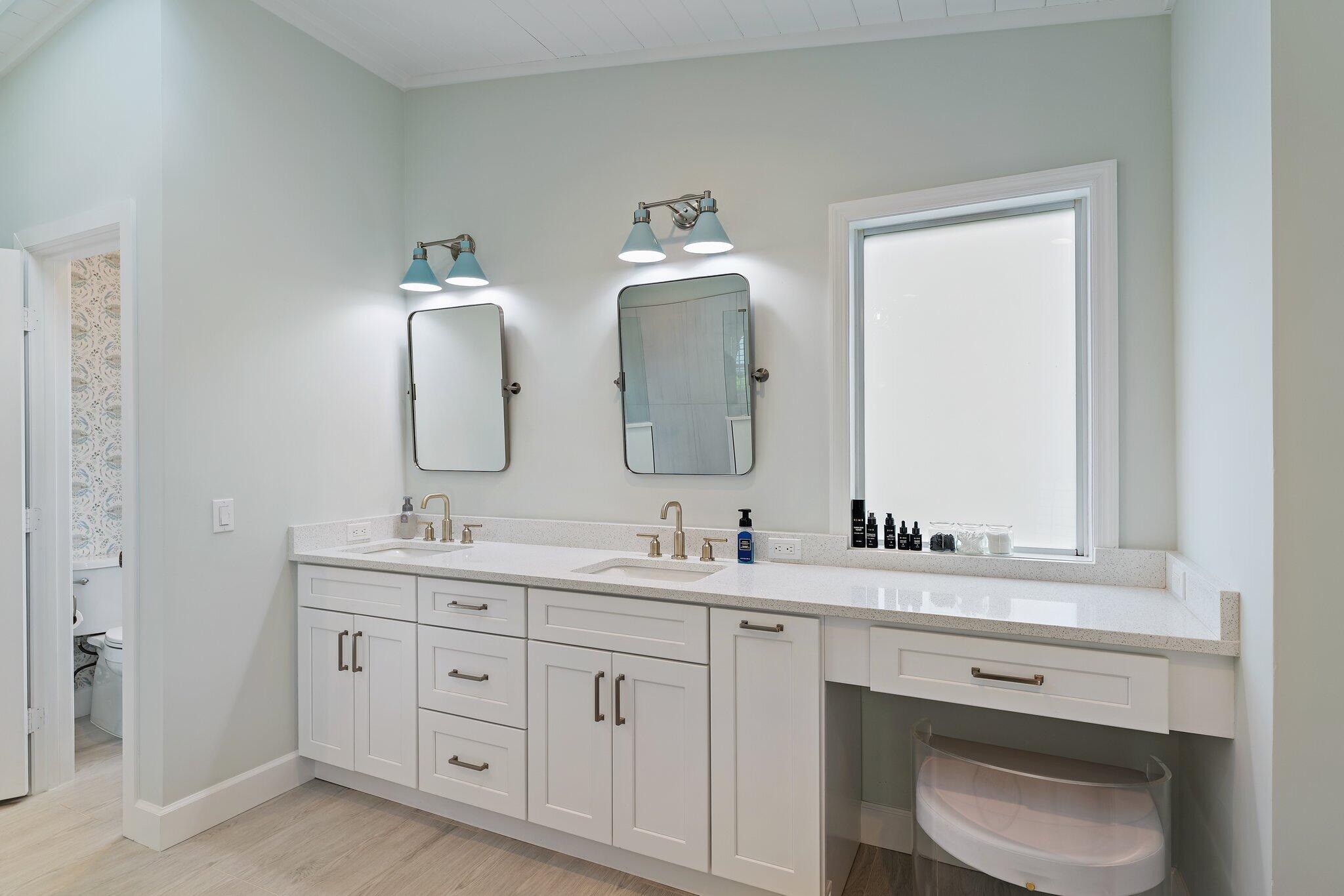 4120 Southeast Whiticar Way Stuart, FL 34997 - Photo 33 of 60 a bathroom with a double vanity sink and mirror