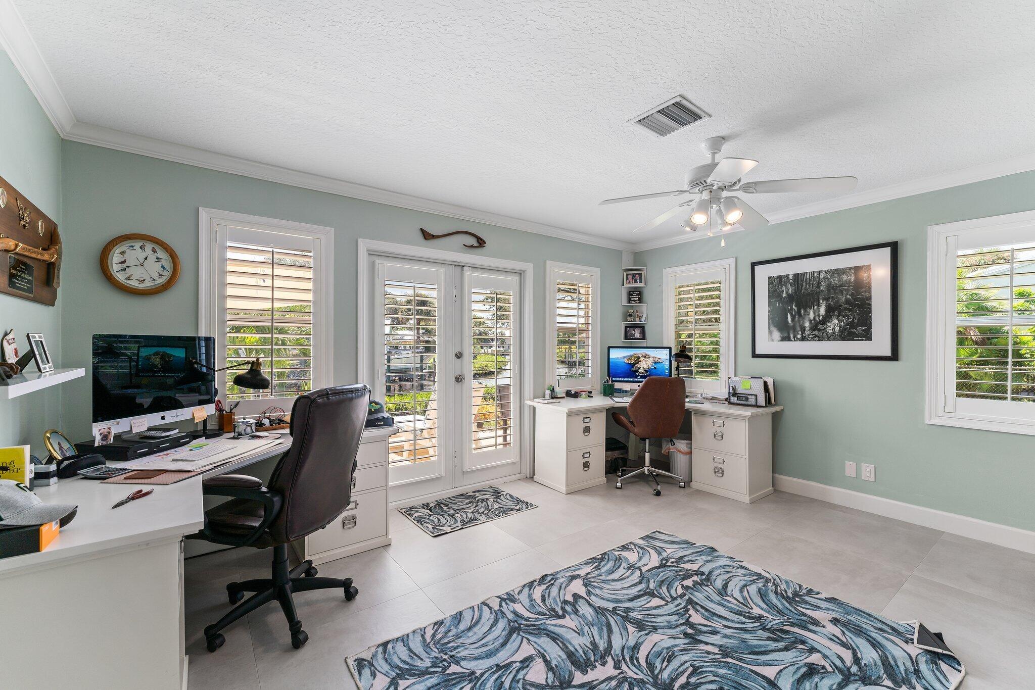 4120 Southeast Whiticar Way Stuart, FL 34997 - Photo 34 of 60 a view of a workspace with furniture and a window