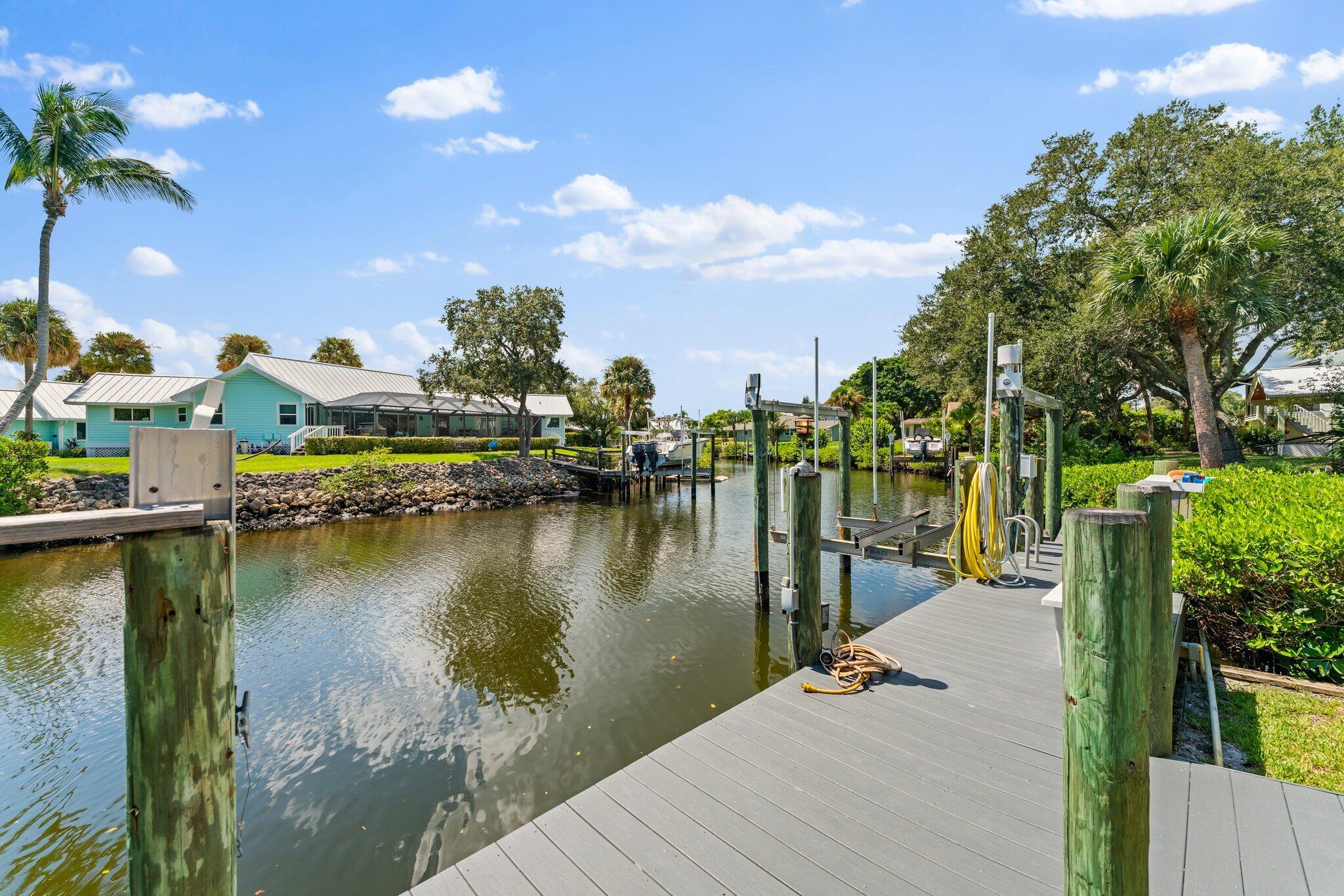 4120 Southeast Whiticar Way Stuart, FL 34997 - Photo 42 of 60 a view of a lake with houses