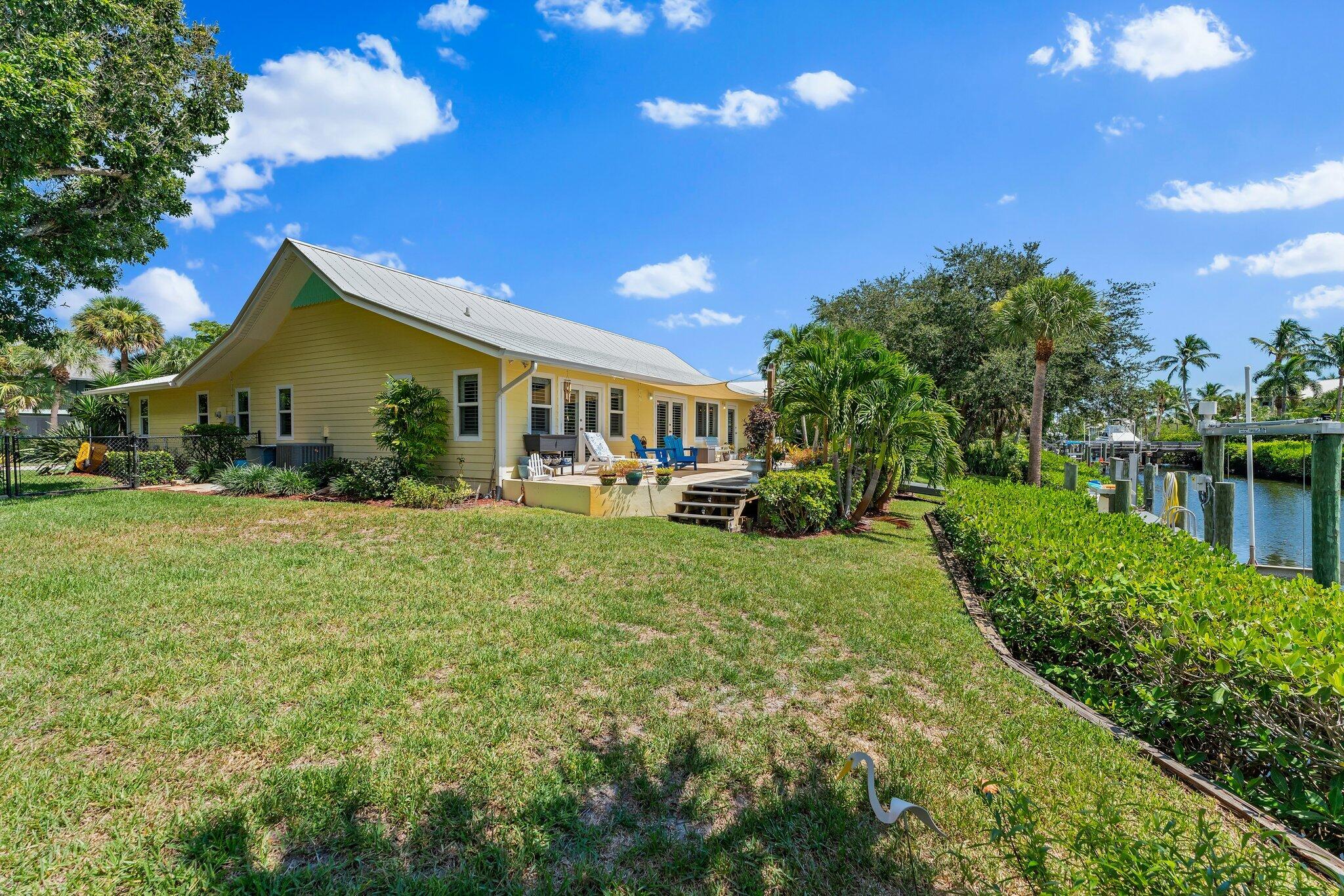 4120 Southeast Whiticar Way Stuart, FL 34997 - Photo 52 of 60 a view of house with outdoor space and garden