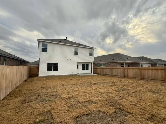 a house view with wooden fence