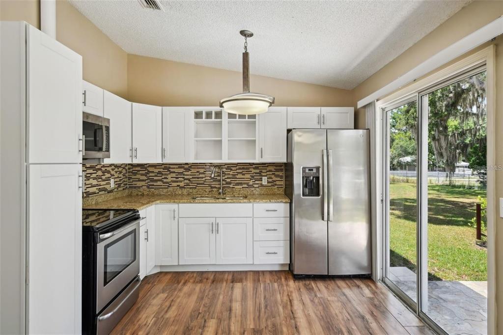 5 Cedar Lane Ocala, FL 34472 - Photo 7 of 23 a kitchen with stainless steel appliances a refrigerator sink and microwave