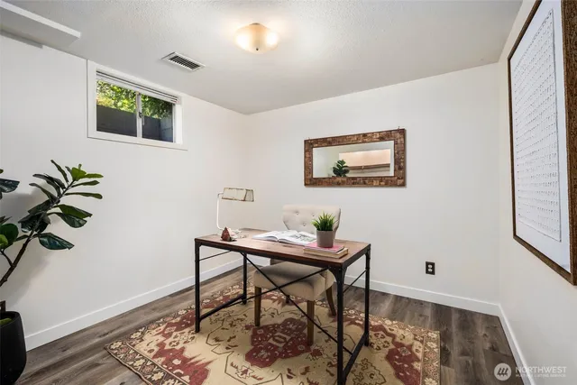 a workspace with furniture and window