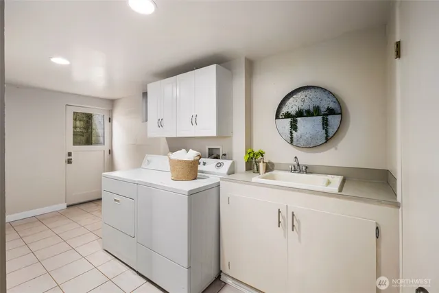 a room with a sink and a mirror