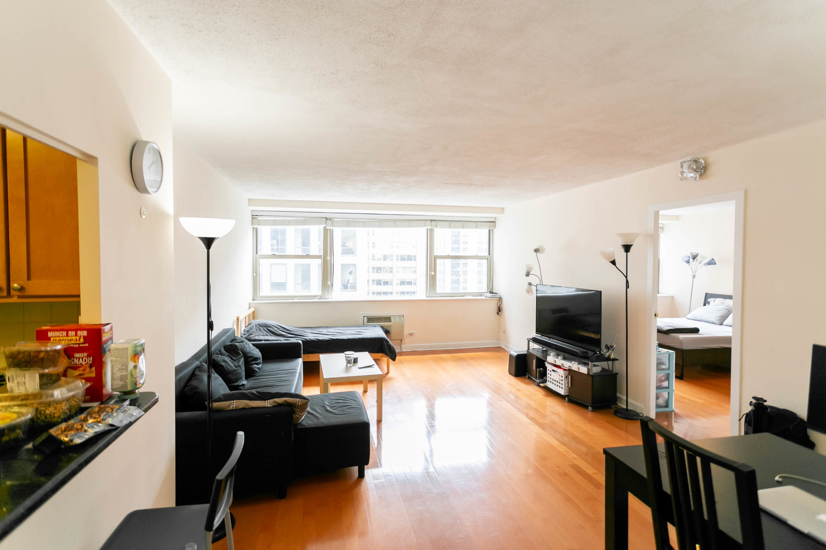 253 East Delaware Place, Unit 14C Chicago, IL 60611 - Photo 2 of 7 a living room with furniture fireplace and flat screen tv