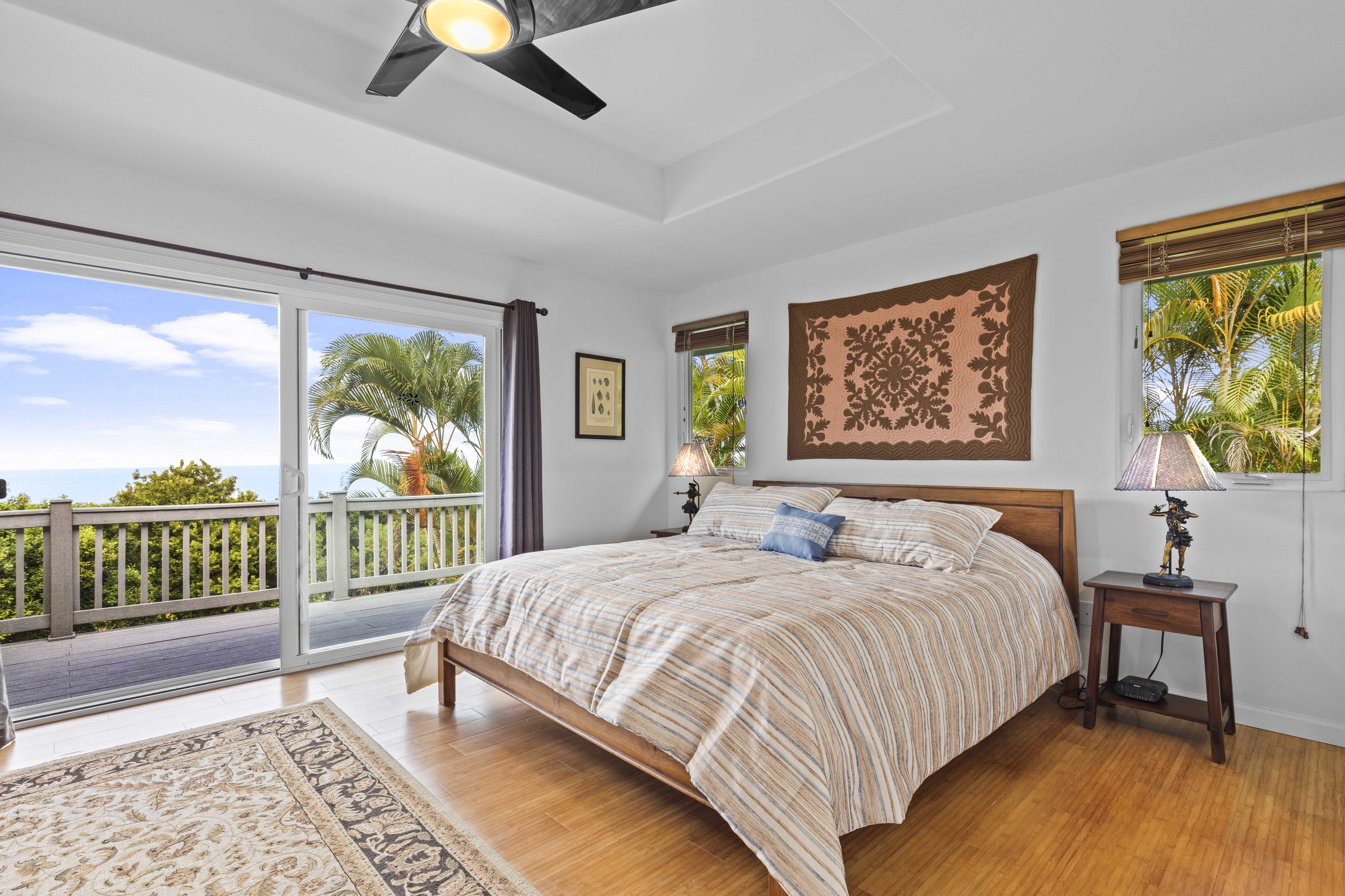 84-4955 Ke Ala O Keawe Road Captain Cook, HI 96704 - Photo 11 of 23 a bedroom with a bed and a large window