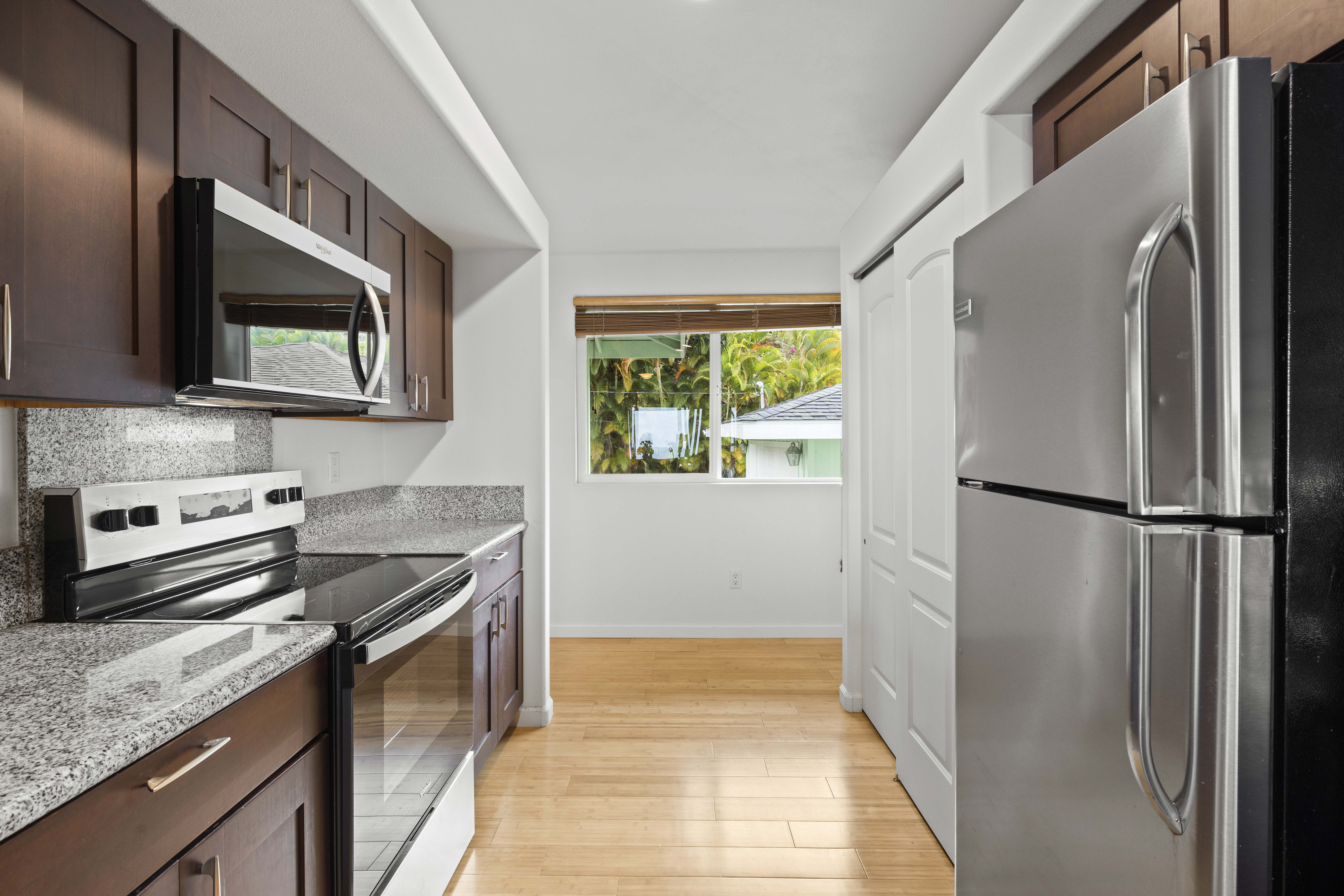 84-4955 Ke Ala O Keawe Road Captain Cook, HI 96704 - Photo 17 of 23 a kitchen with a refrigerator stove and microwave