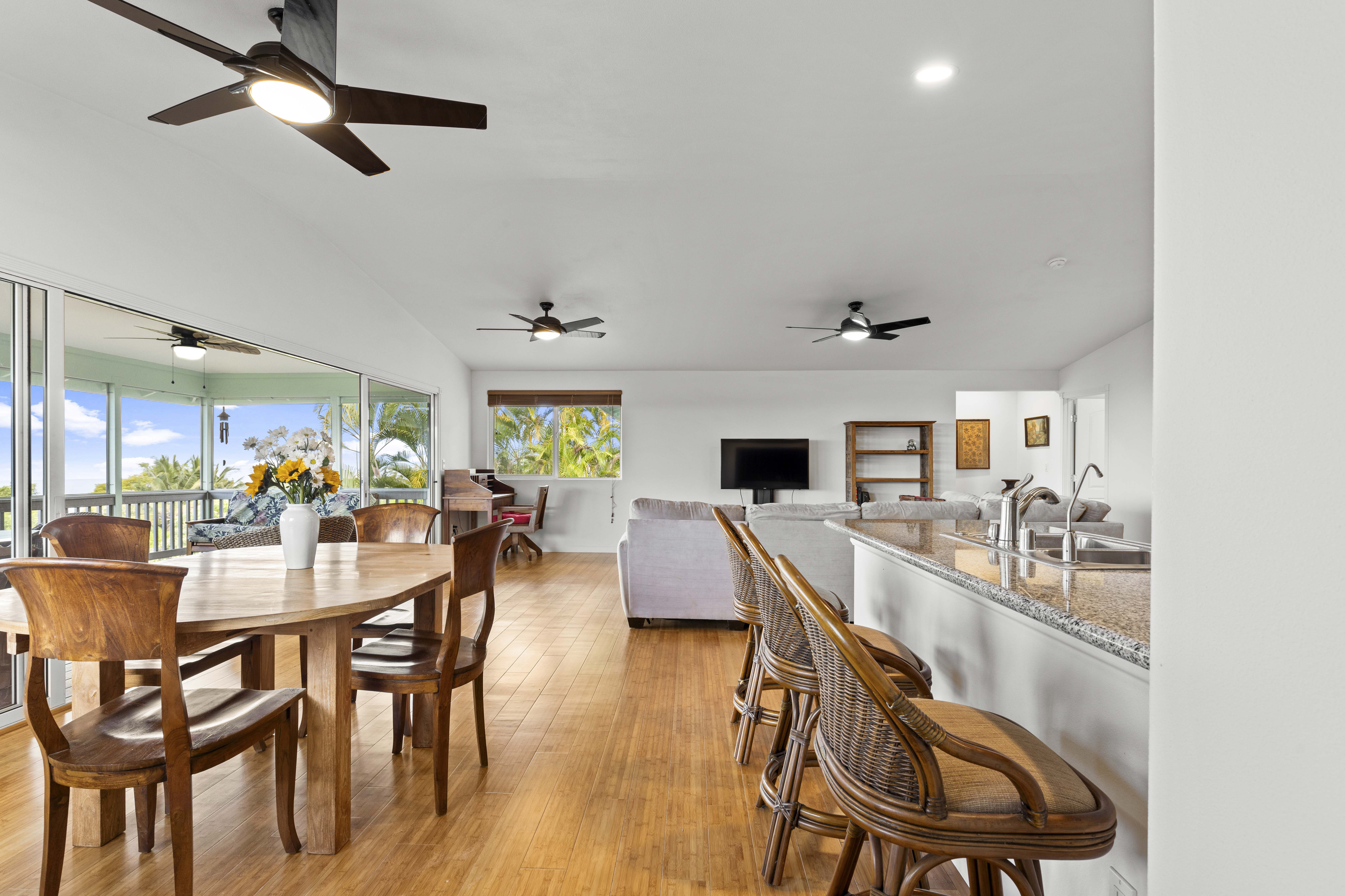 84-4955 Ke Ala O Keawe Road Captain Cook, HI 96704 - Photo 19 of 23 a view of a dining room with furniture and wooden floor