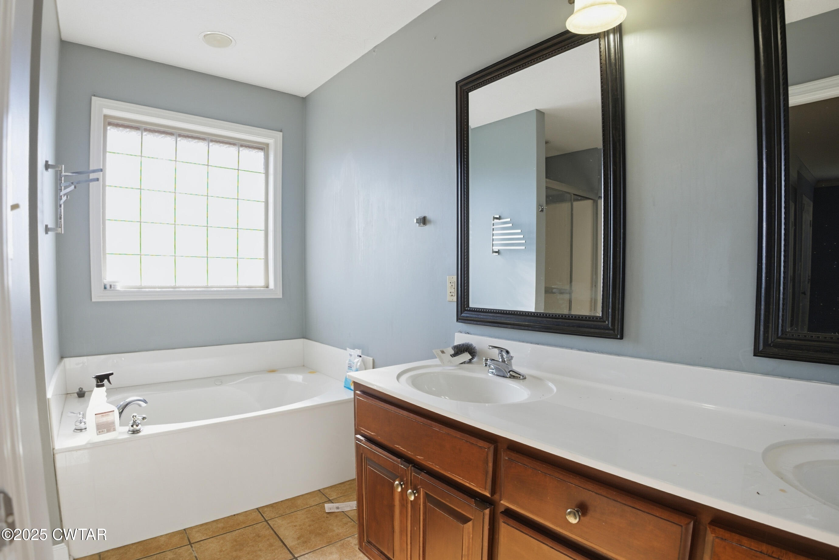 766 Mason Avenue Henderson, TN 38340 - Photo 13 of 16 a bathroom with a tub sink and mirror