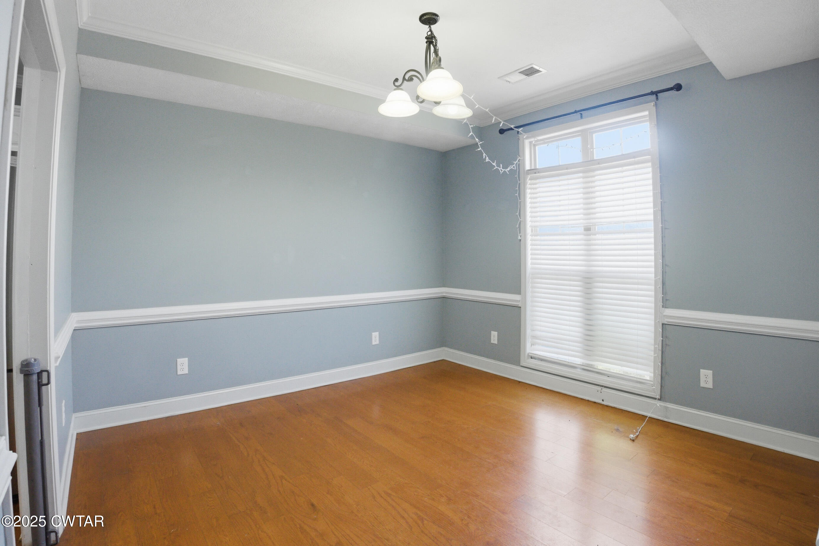 766 Mason Avenue Henderson, TN 38340 - Photo 5 of 16 wooden floor in an empty room with a window