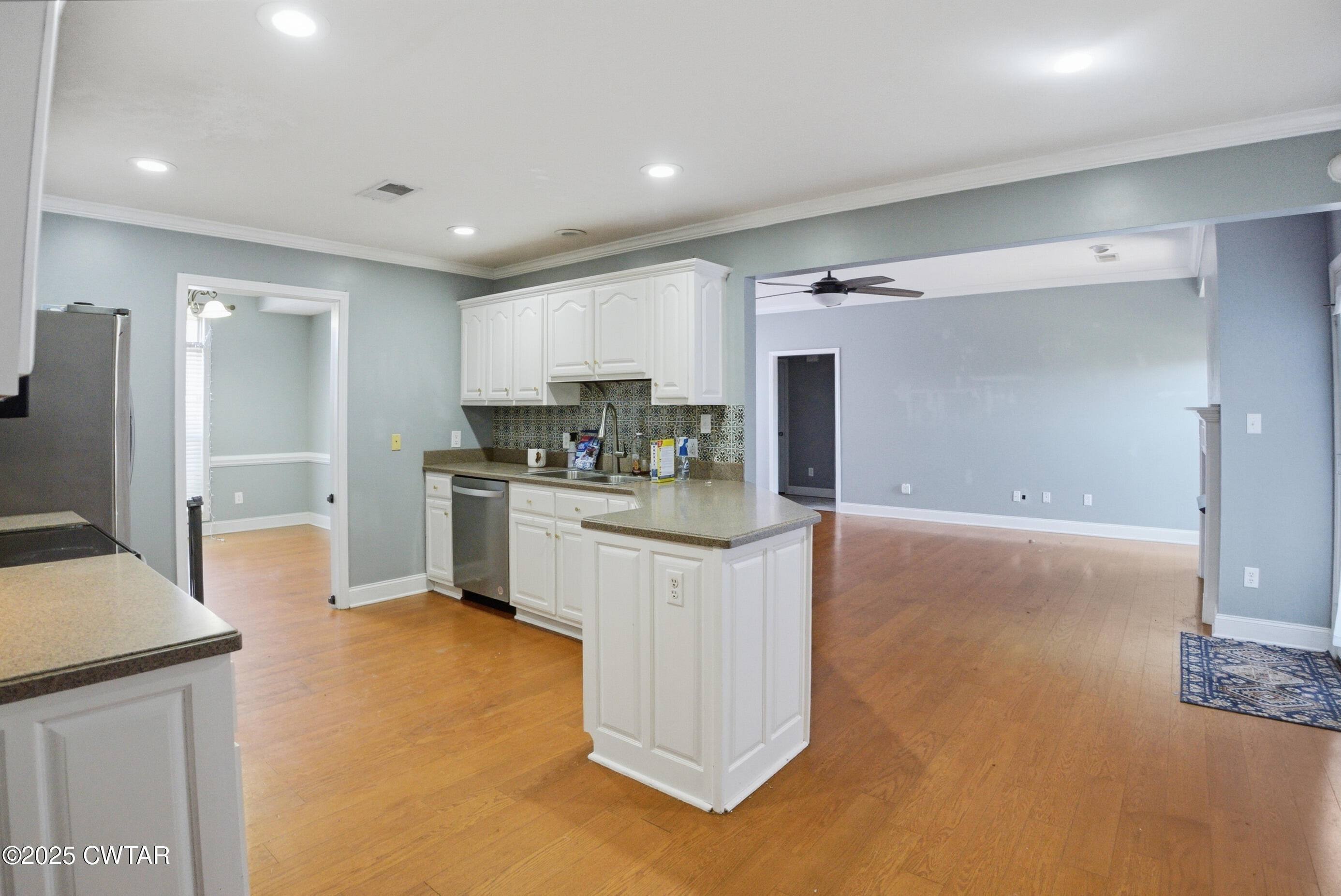 766 Mason Avenue Henderson, TN 38340 - Photo 8 of 16 a kitchen with white cabinets and refrigerator