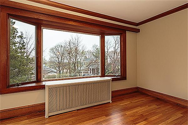59 Coolidge Road Arlington, MA 02476 - Photo 6 of 22 a view of a room that has wooden floor and a window