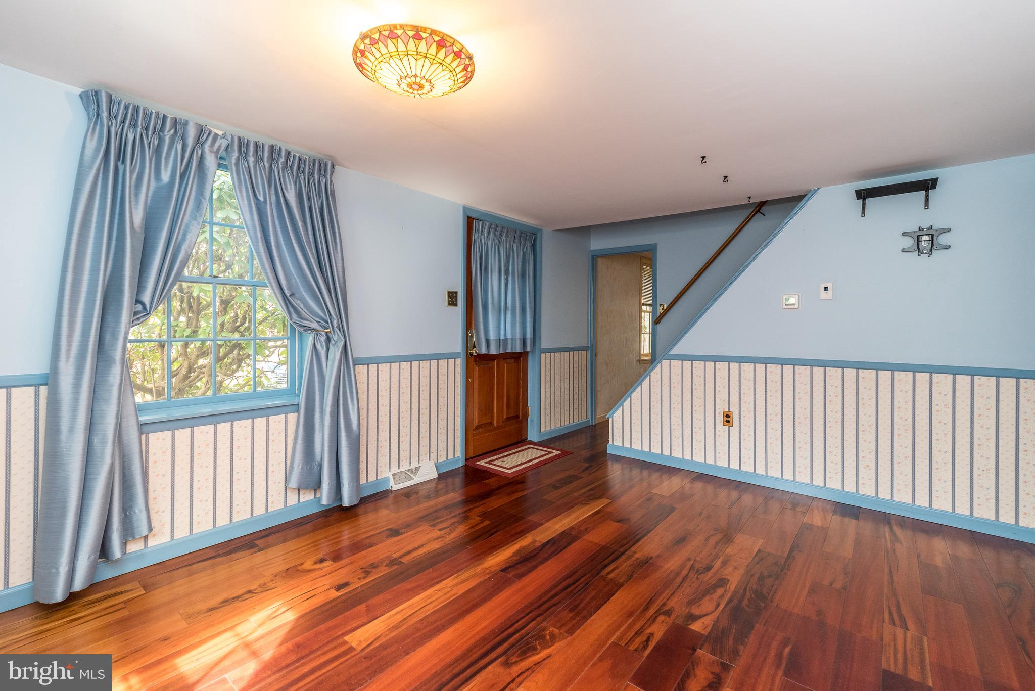 2361 Turk Road Doylestown, PA 18901 - Photo 11 of 32 a view of a hallway with wooden floor and stairs