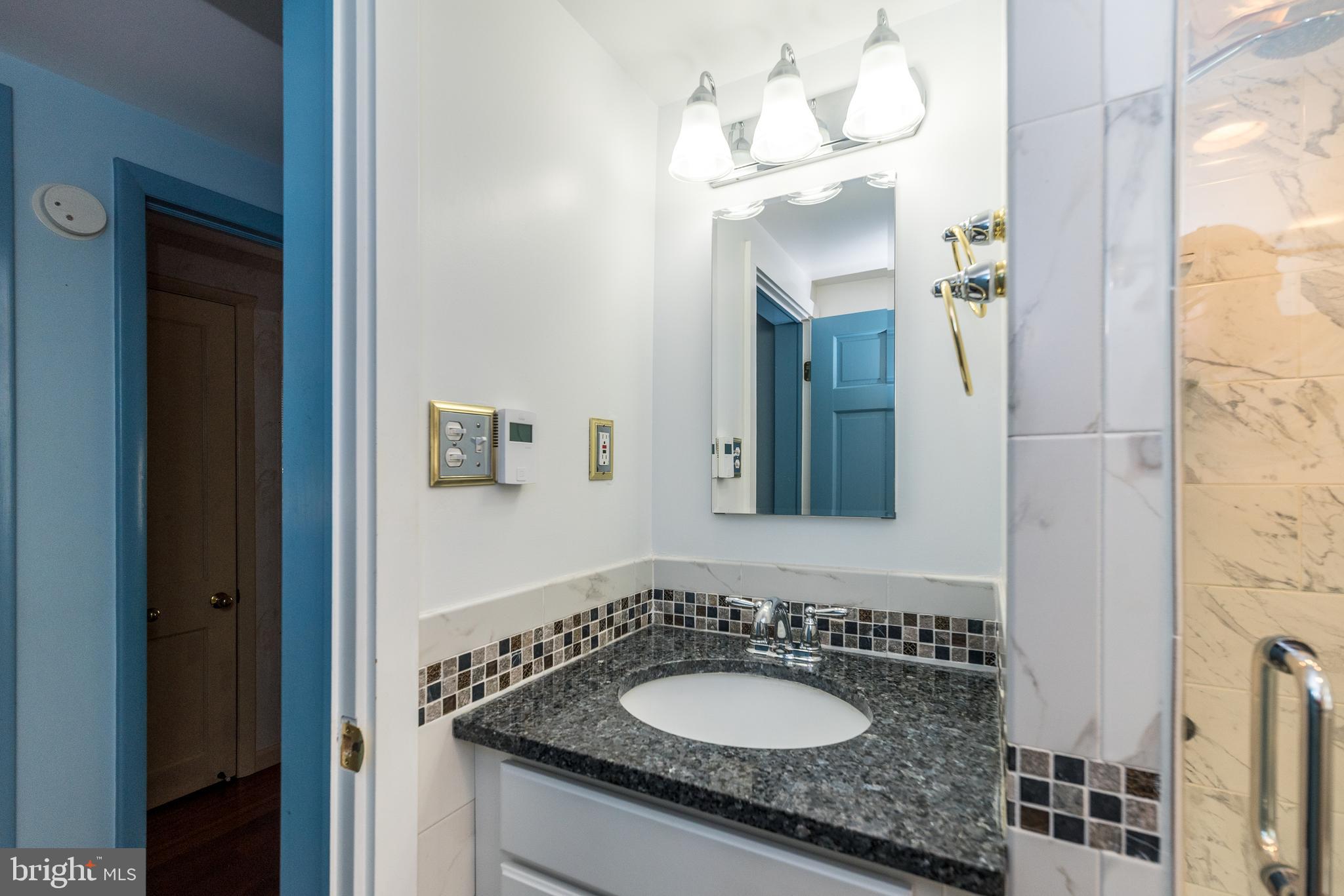 2361 Turk Road Doylestown, PA 18901 - Photo 15 of 32 a bathroom with a granite countertop sink and a mirror