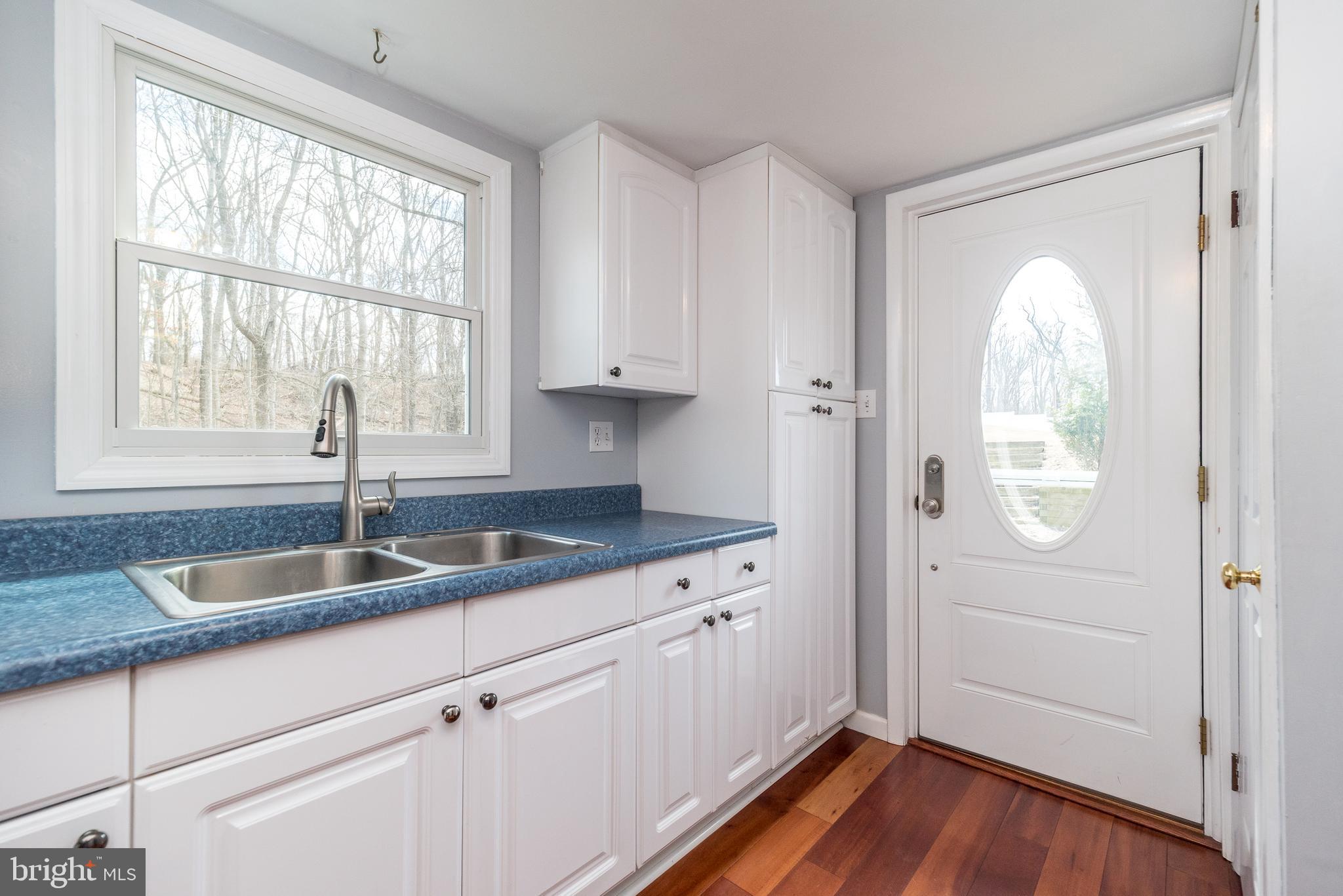 2361 Turk Road Doylestown, PA 18901 - Photo 20 of 32 a kitchen with a sink window and cabinets