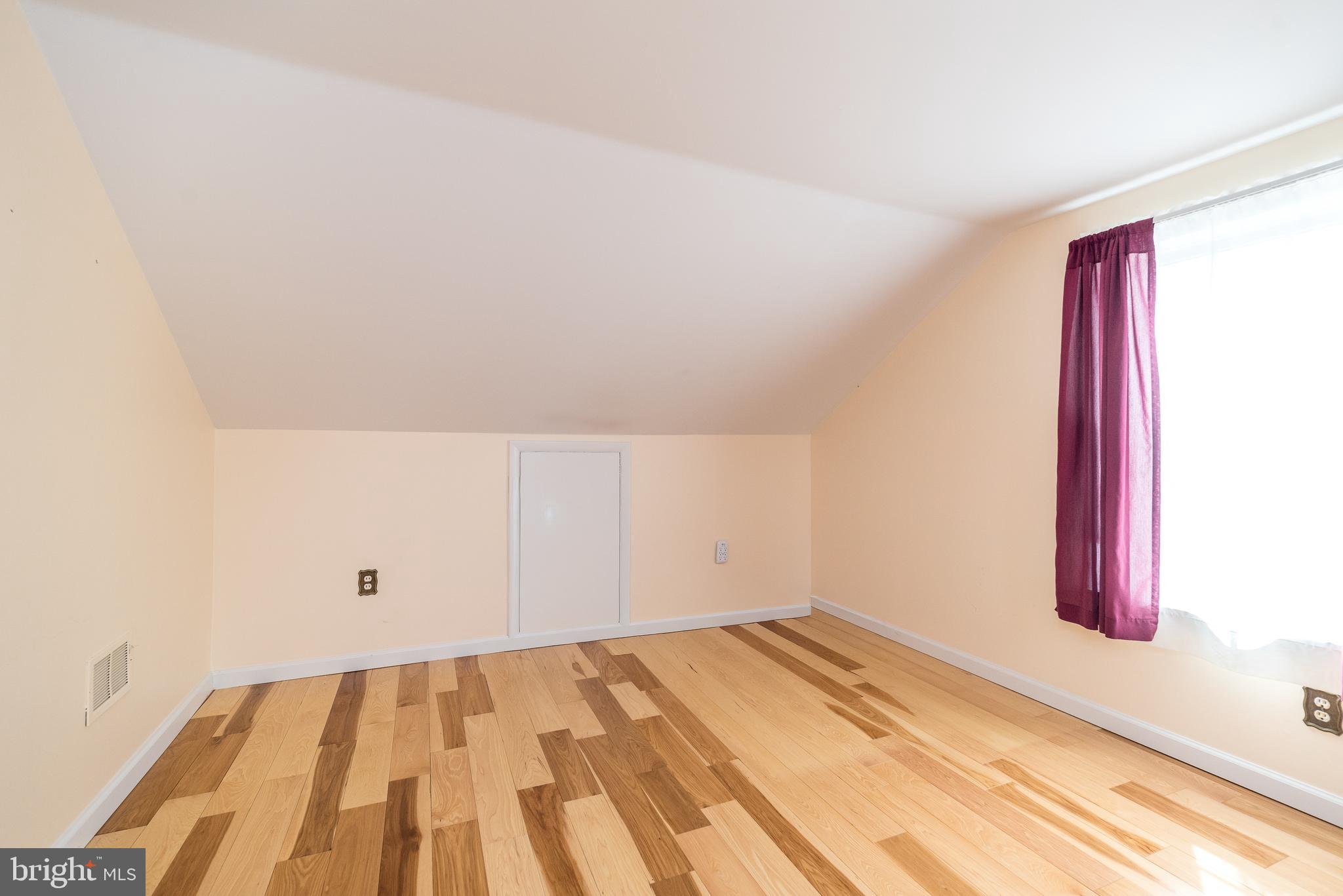 2361 Turk Road Doylestown, PA 18901 - Photo 4 of 32 a view of a room with wooden floor and bench