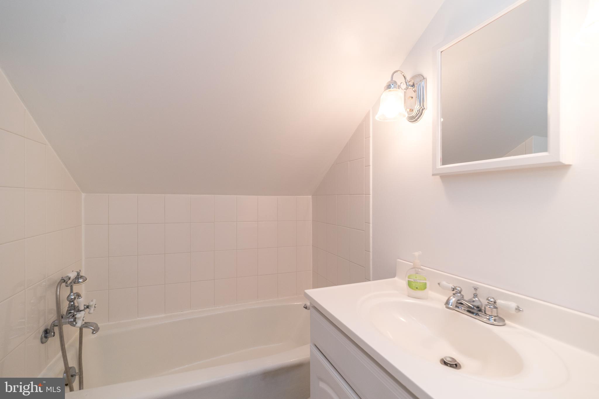 2361 Turk Road Doylestown, PA 18901 - Photo 5 of 32 a bathroom with a sink and a mirror