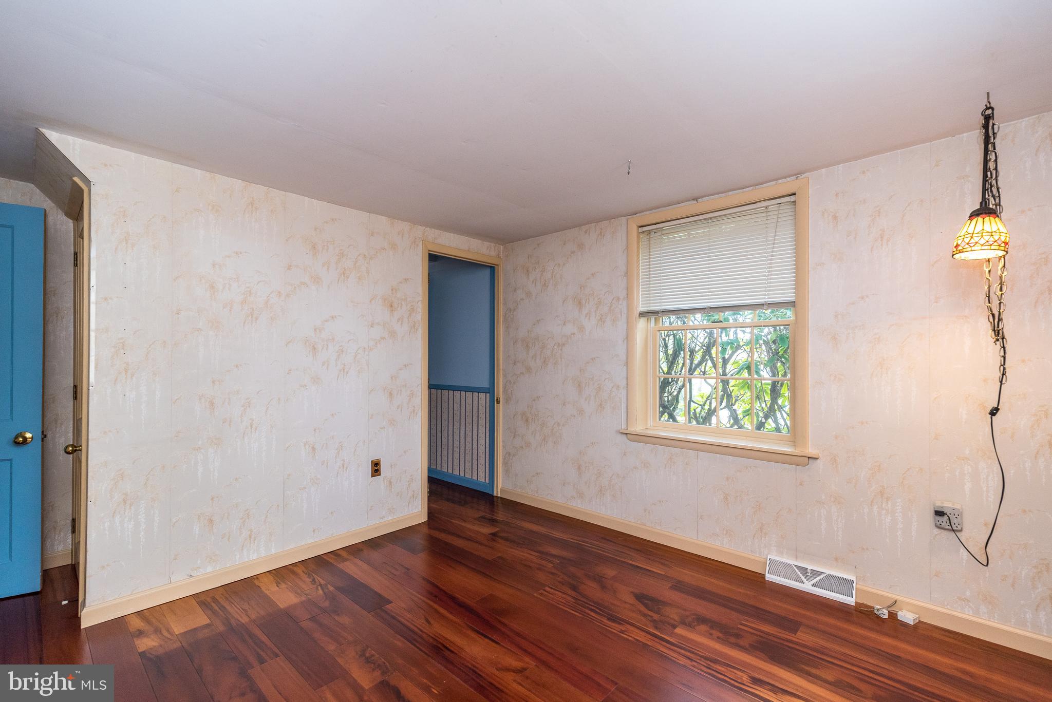 2361 Turk Road Doylestown, PA 18901 - Photo 8 of 32 an empty room with wooden floor and windows